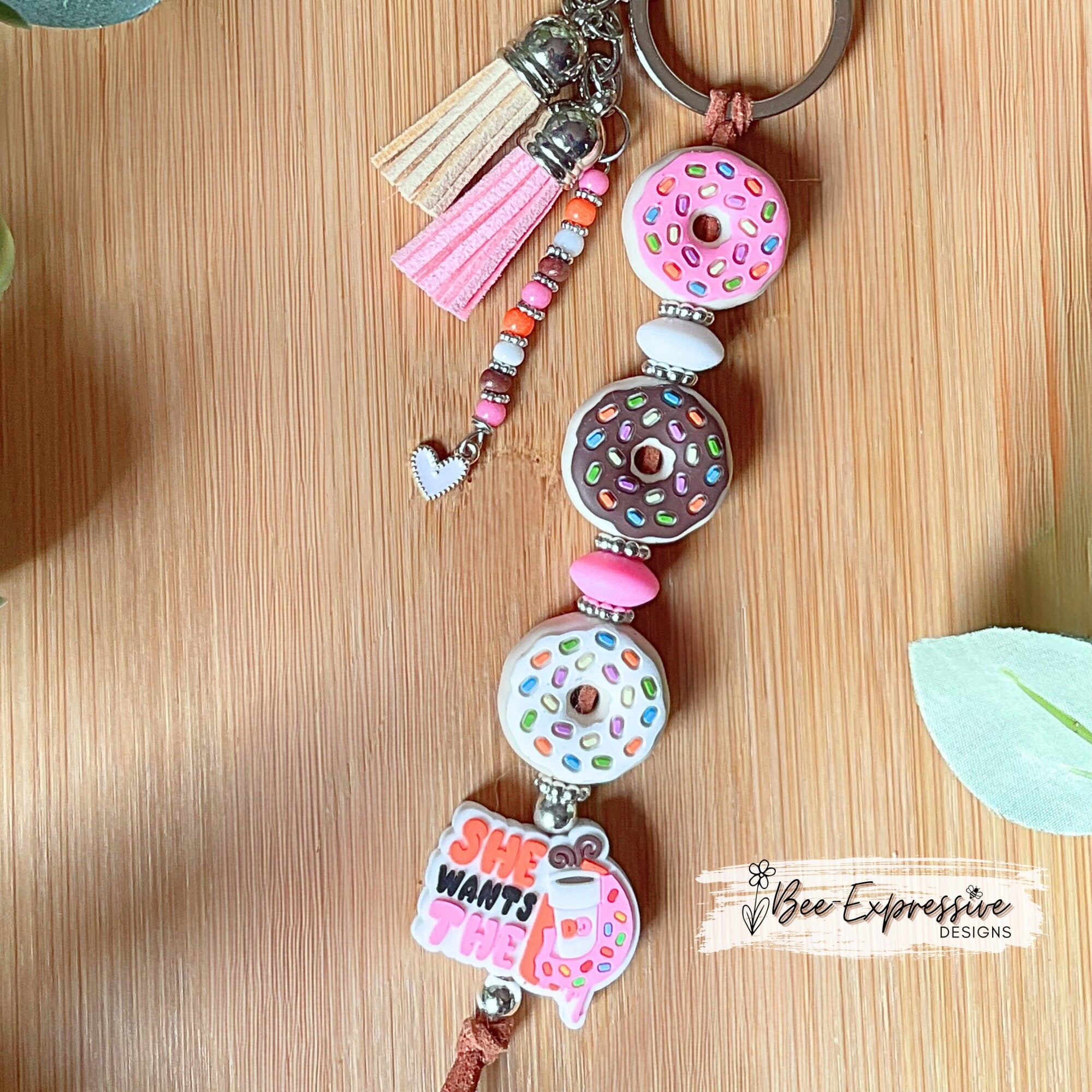 Handmade, DD donut inspired keychain! Lobster or swivel clasp, suede cord, silicone donut beads, beaded tassel with a heart charm!