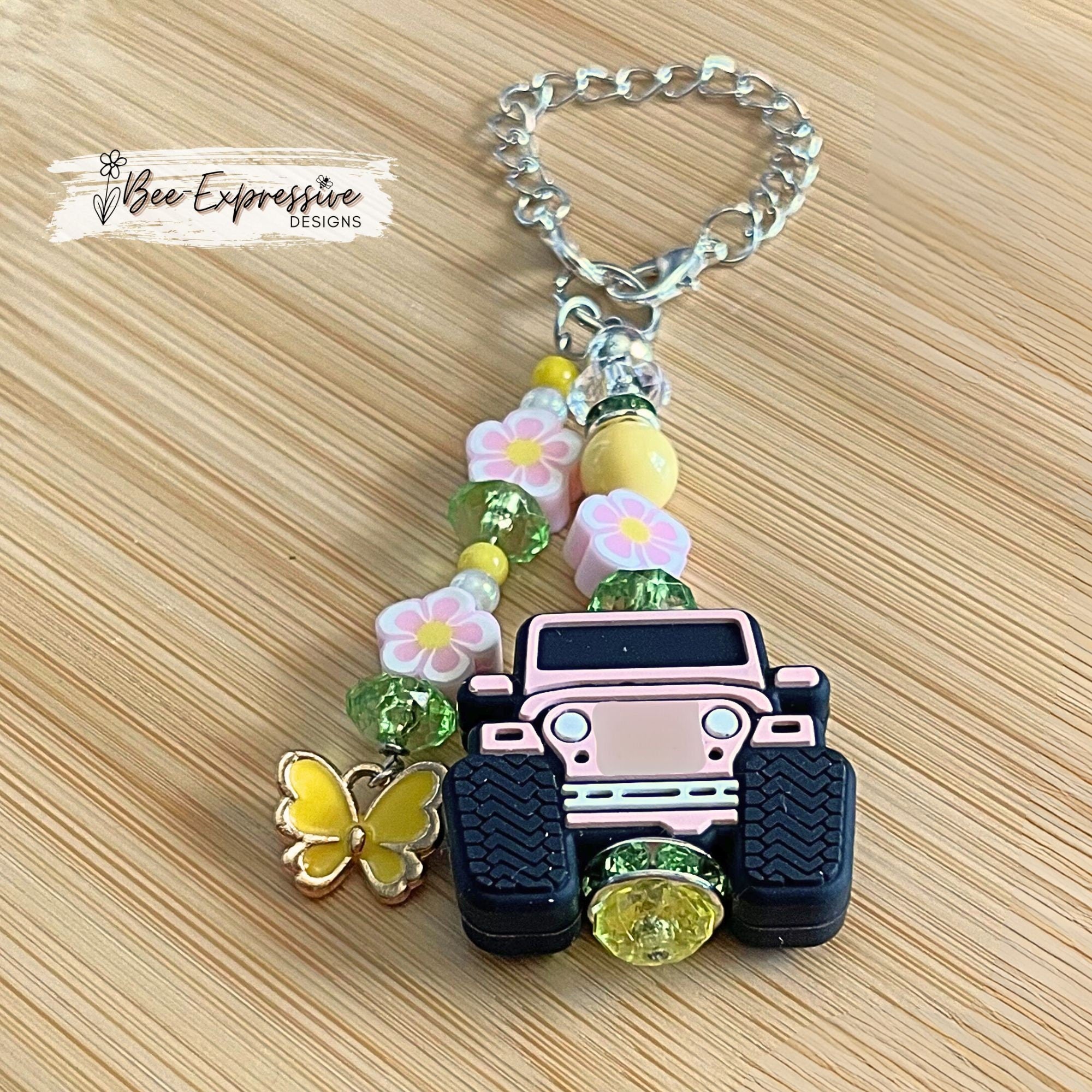 Handmade, pink 4x4 vehicle charm chain for a tumbler!  Acrylic beads, lobster claw clasps, beaded tassel, clay flower beads, butterfly charm
