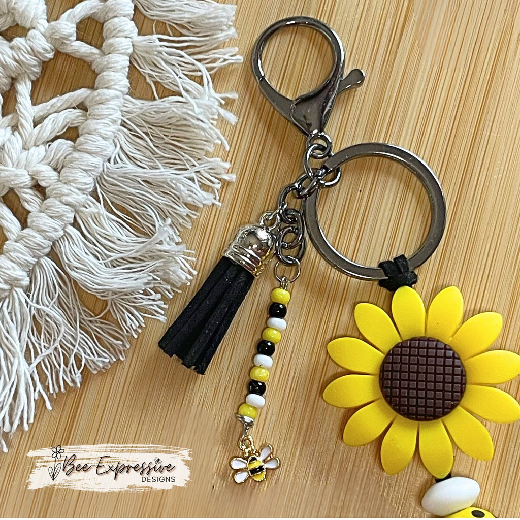 Handmade, bright and colorful, silicone sunflower keychain with bee beads! Lobster clasp on suede cord, beaded tassel bee charm pendant