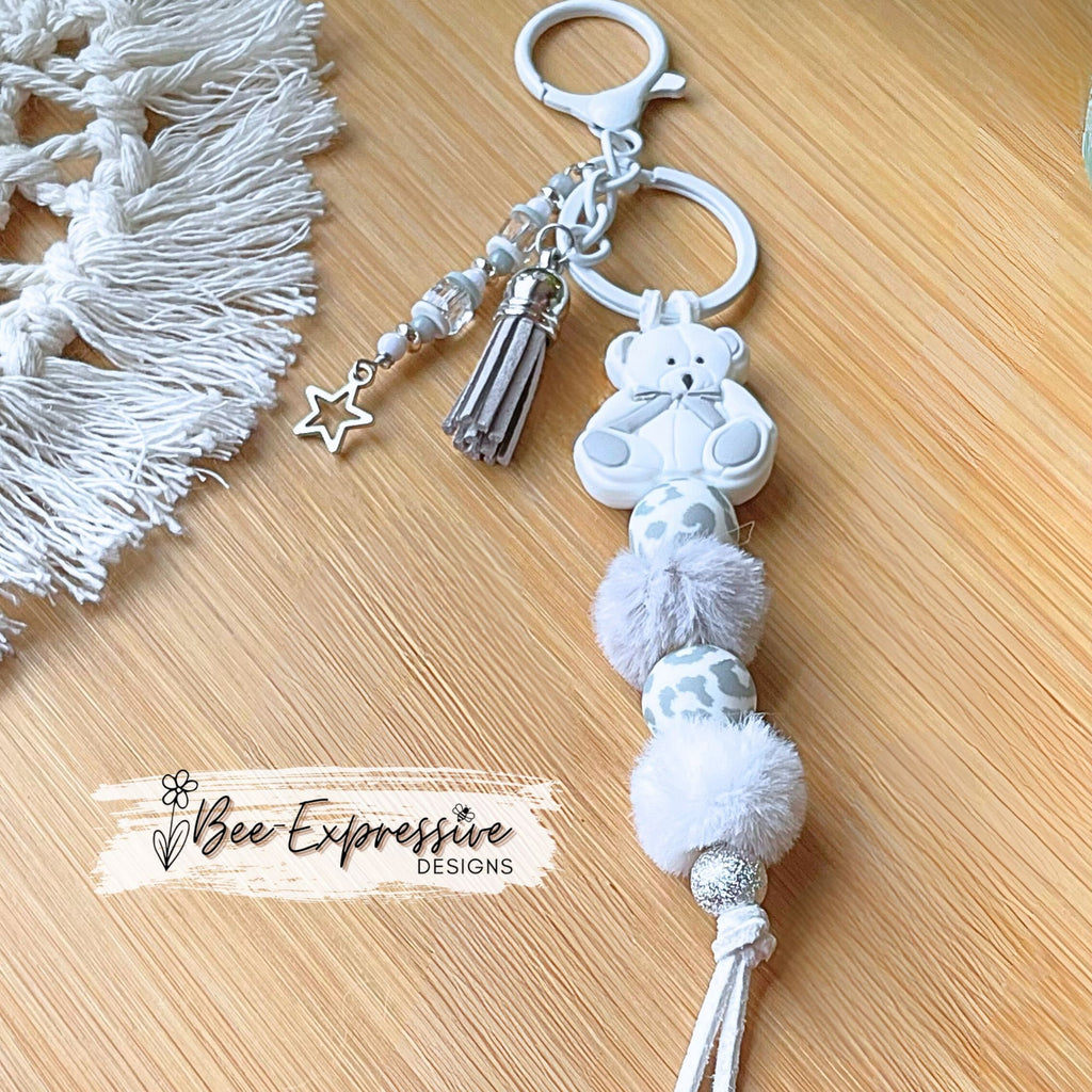 Adorable, handmade, teddy bear keychain! White lobster clasp, suede cord, furry beads, silicone animal print, beaded tassel, star charm!