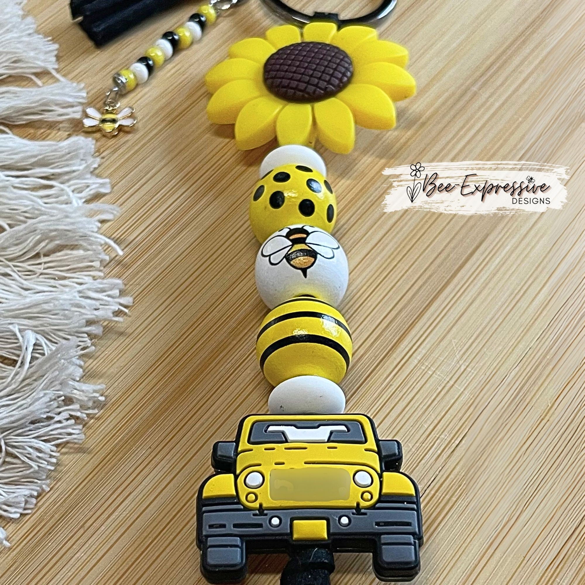 Handmade, bright and colorful, silicone sunflower keychain with bee beads! Lobster clasp on suede cord, beaded tassel bee charm pendant
