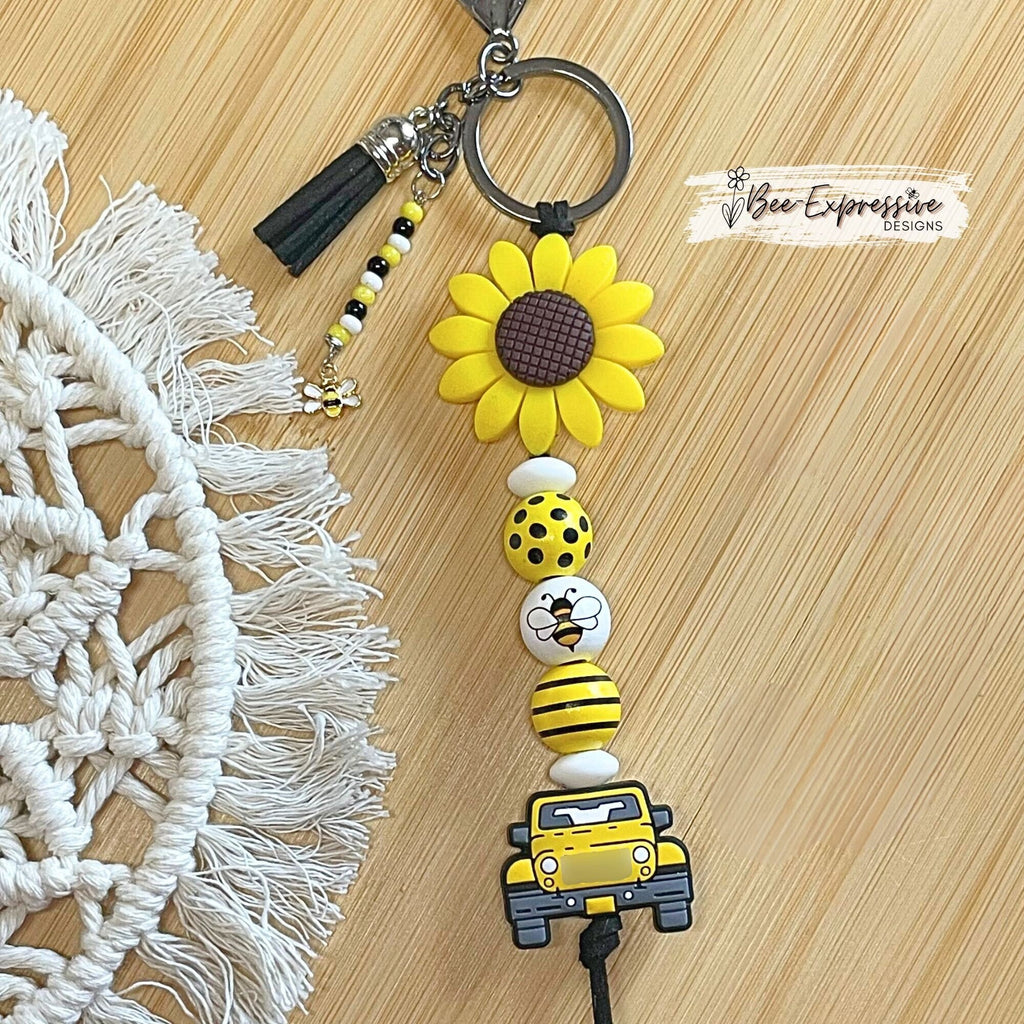 Handmade, bright and colorful, silicone sunflower keychain with bee beads! Lobster clasp on suede cord, beaded tassel bee charm pendant