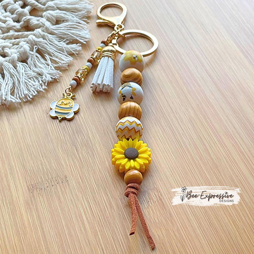Adorable, handmade BEE gnome keychain! Lobster claw clasp, suede cord, silicone sunflower, printed wood beads, beaded tassel, bee charm!