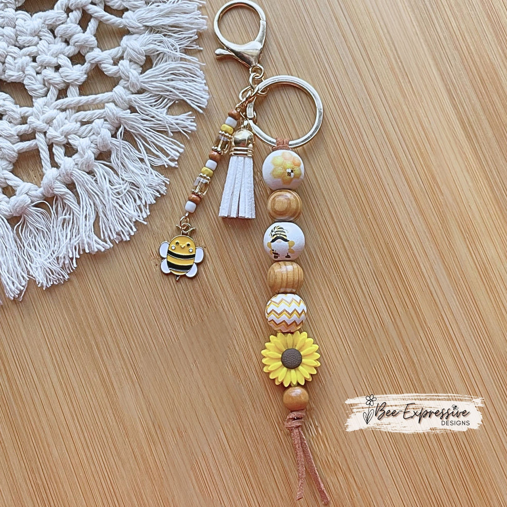 Adorable, handmade BEE gnome keychain! Lobster claw clasp, suede cord, silicone sunflower, printed wood beads, beaded tassel, bee charm!