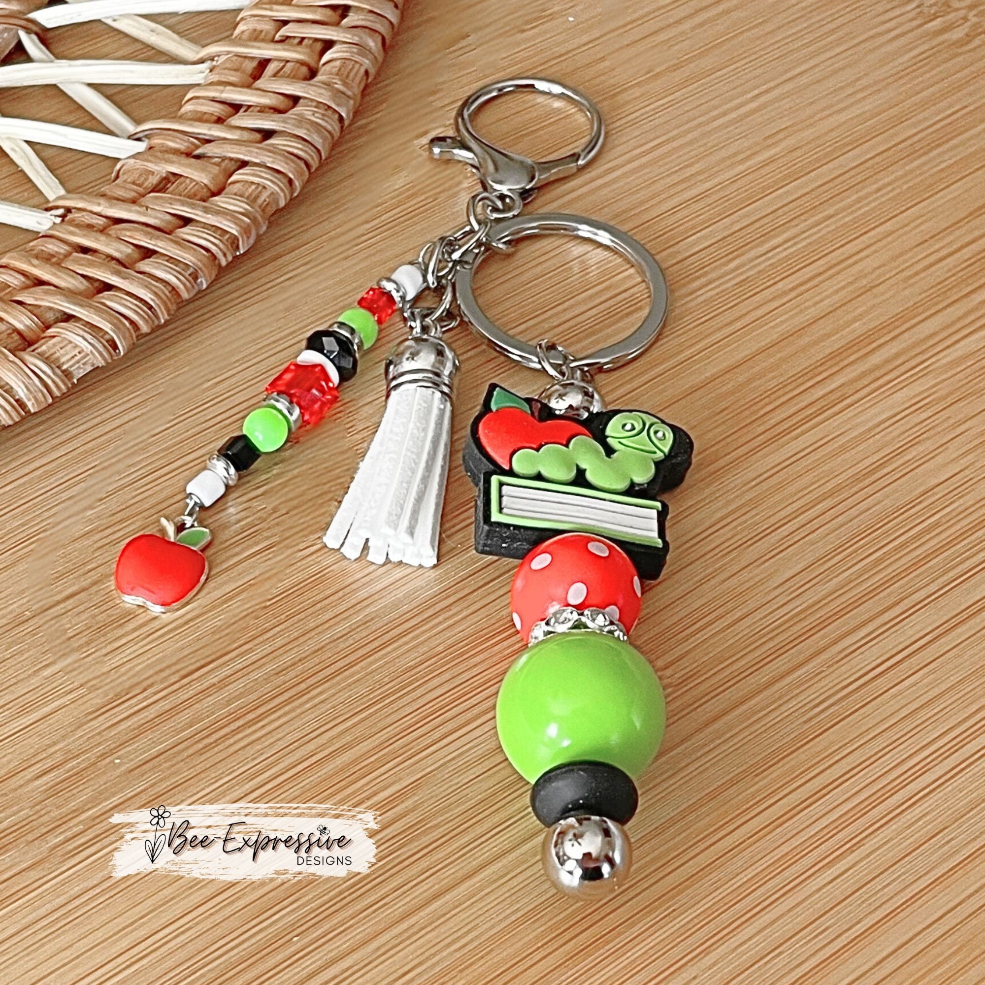 Handmade, unique, book worm teacher keychain! Lobster clasp, metal bar, 20” acrylic bead, beaded tassel with apple charm pendant!