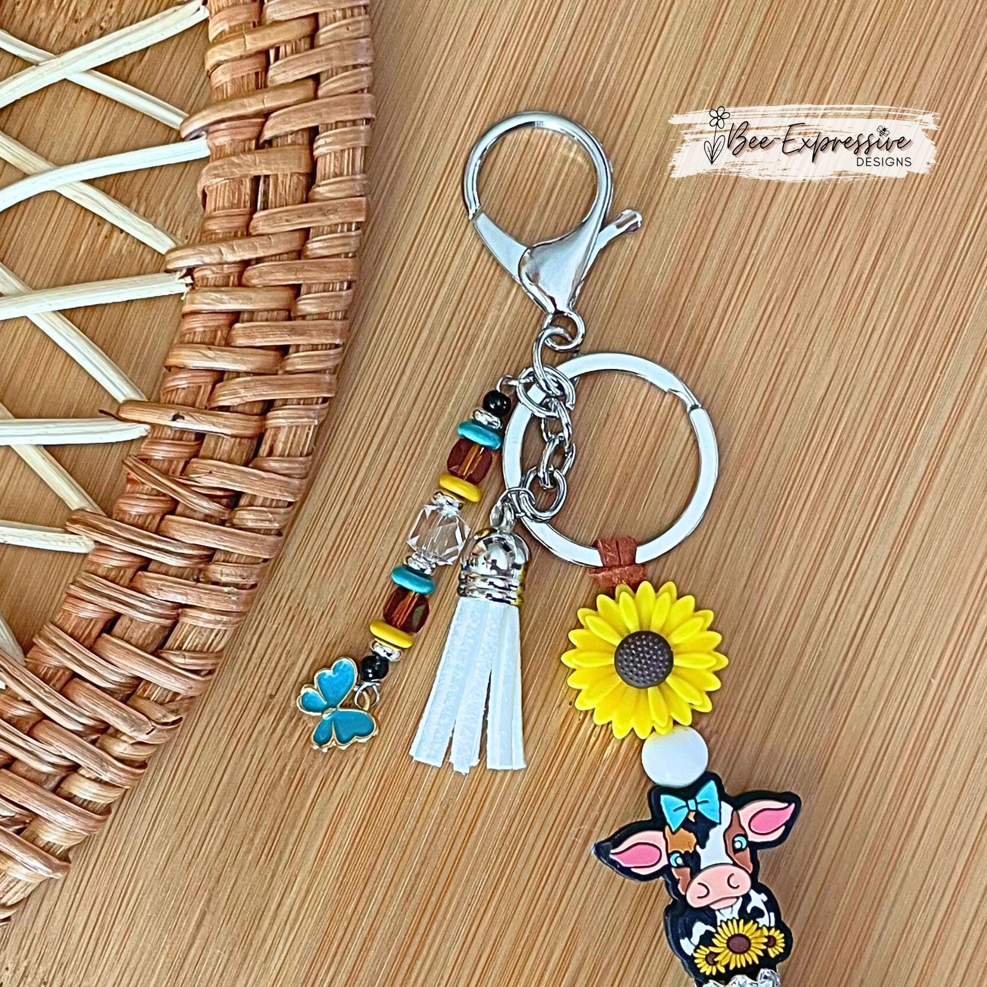 Silicone, DAIRY cow and SUNFLOWER keychain! Lobster or swivel clasp, suede cord, cow print octagon, beaded tassel with butterfly charm!