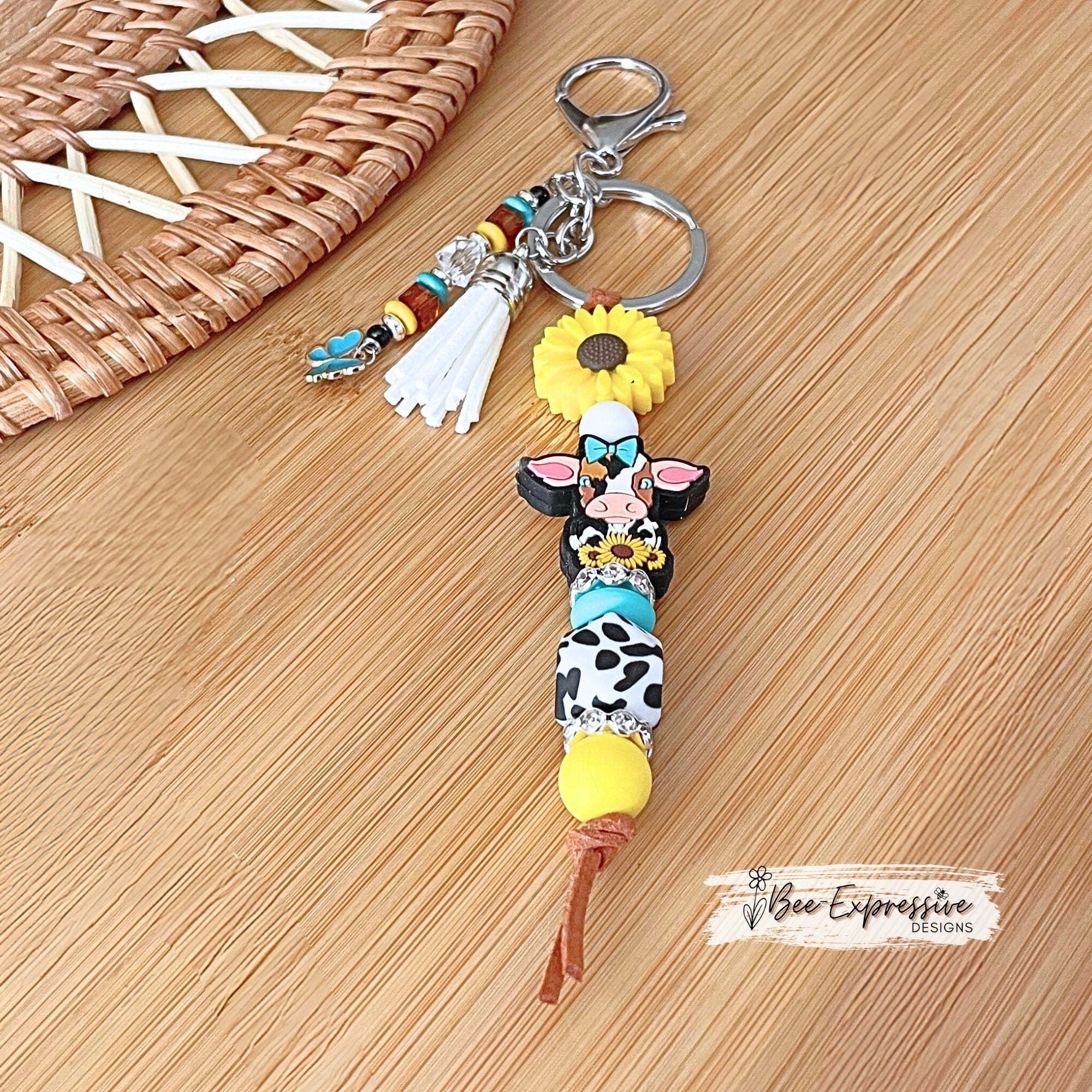 Silicone, DAIRY cow and SUNFLOWER keychain! Lobster or swivel clasp, suede cord, cow print octagon, beaded tassel with butterfly charm!
