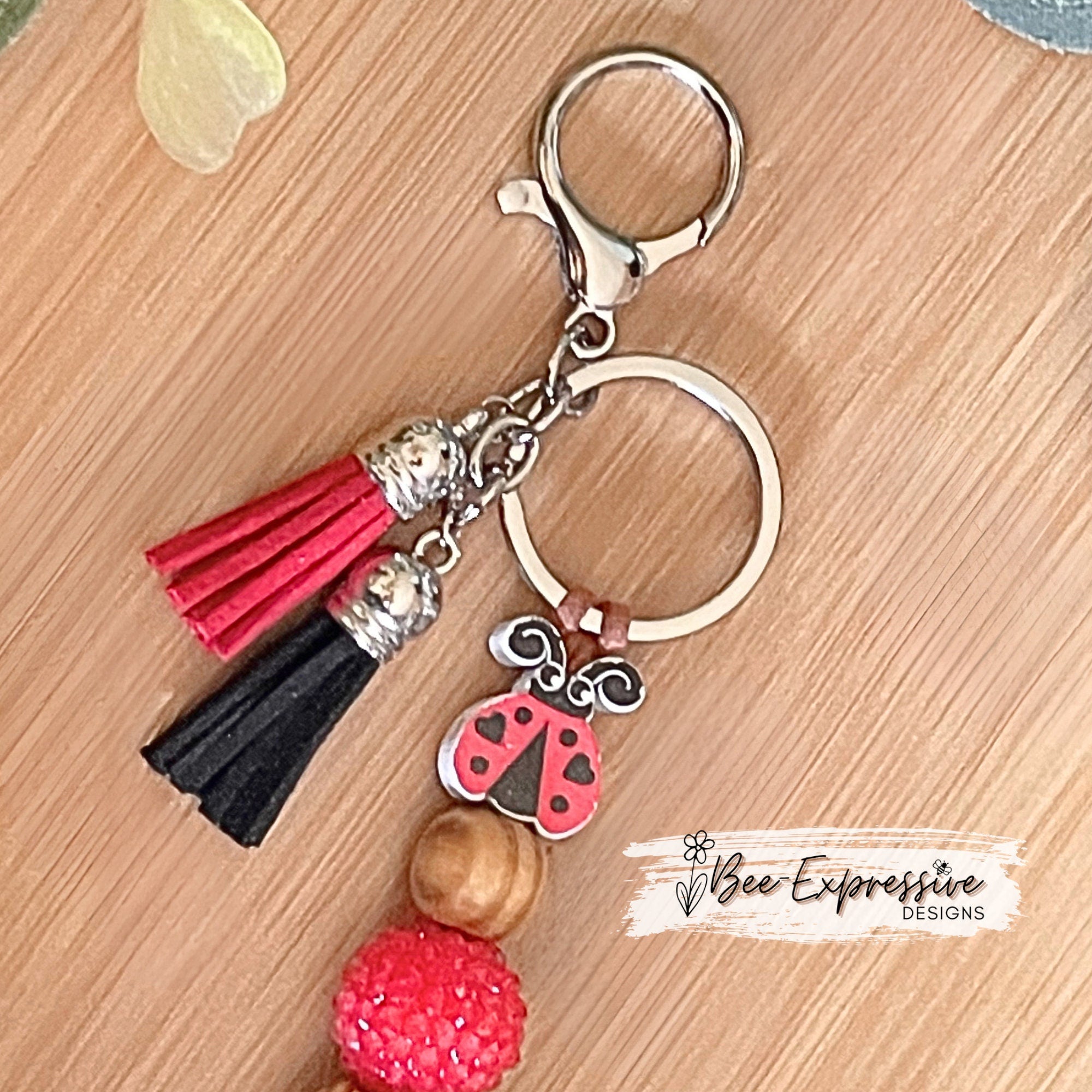Handmade and unique, chunky bead, lady bug keychain!  Lobster claw clasp, suede cord, 20mm wood and acrylic beads, gingham bow, tassels