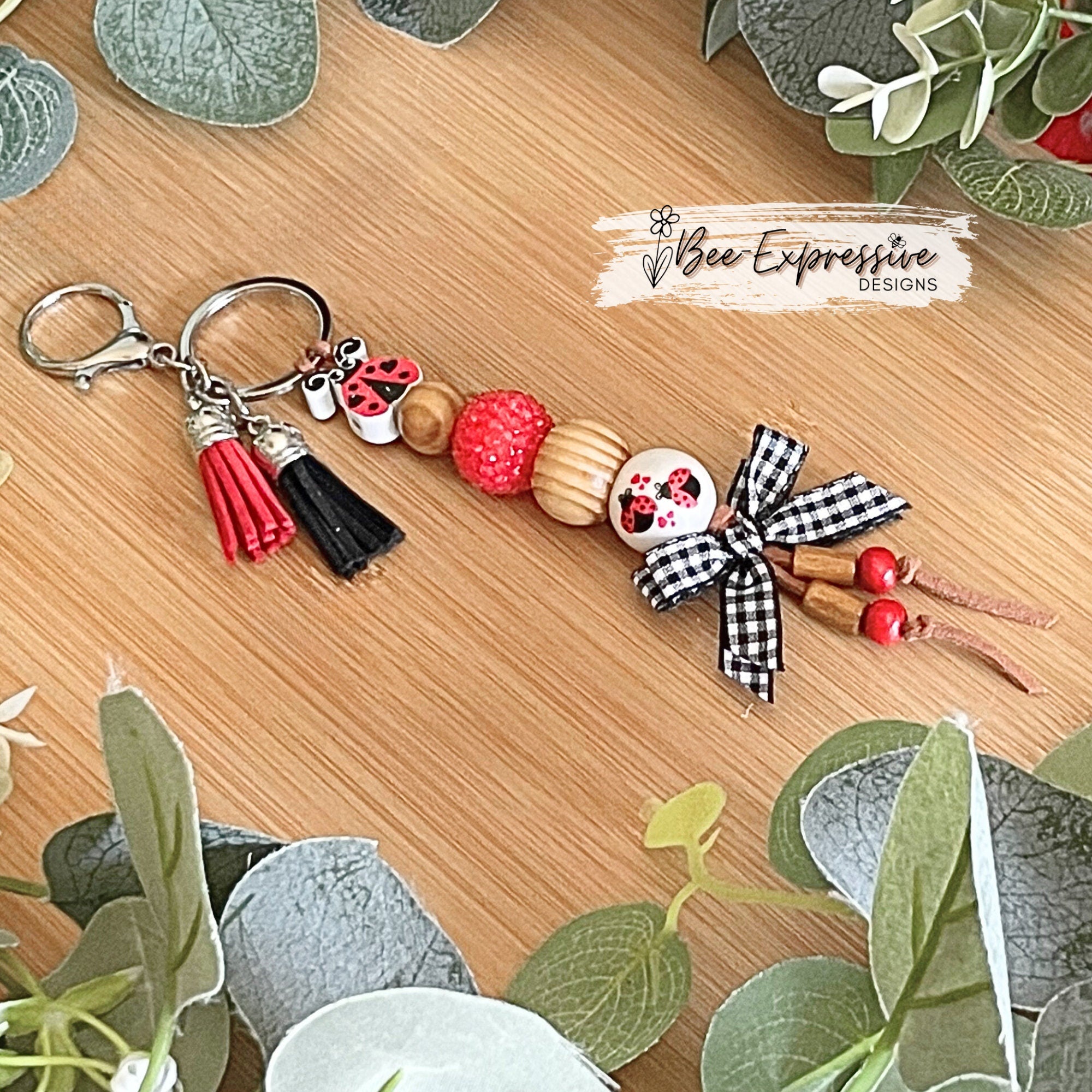 Handmade and unique, chunky bead, lady bug keychain!  Lobster claw clasp, suede cord, 20mm wood and acrylic beads, gingham bow, tassels