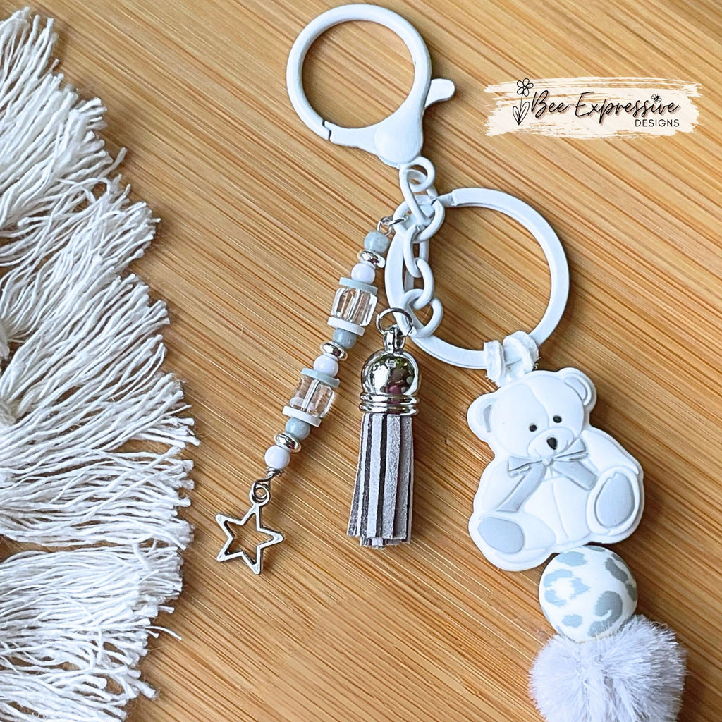 Adorable, handmade, teddy bear keychain! White lobster clasp, suede cord, furry beads, silicone animal print, beaded tassel, star charm!