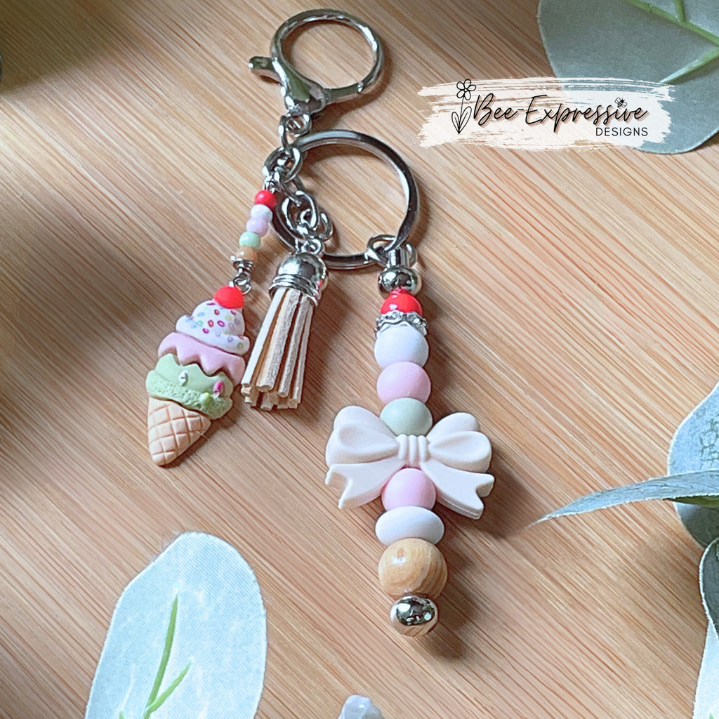 Adorable, handmade, beaded ice cream keychain! Choose a lobster claw or swivel clasp, metal bar, silicone bow, beaded tassel, dessert charm