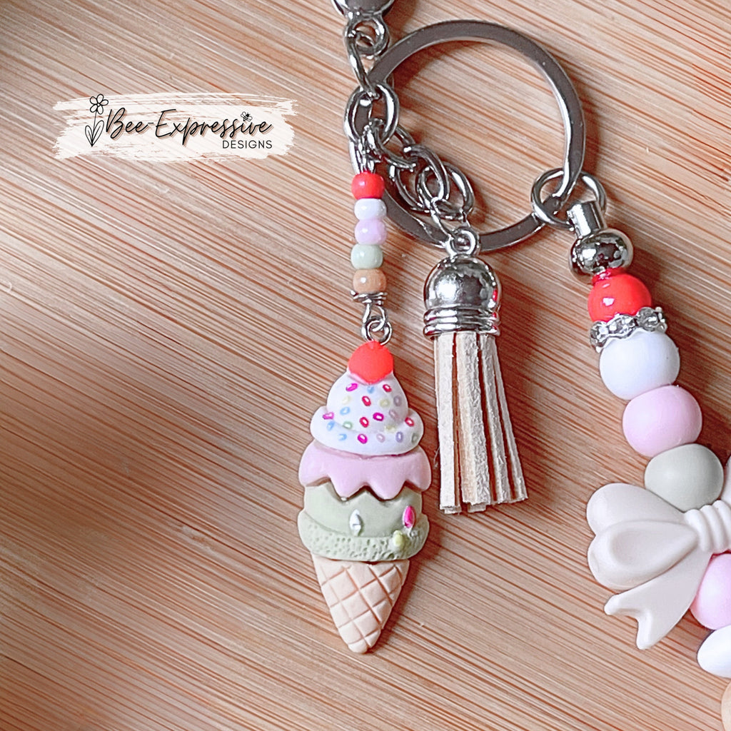 Adorable, handmade, beaded ice cream keychain! Choose a lobster claw or swivel clasp, metal bar, silicone bow, beaded tassel, dessert charm