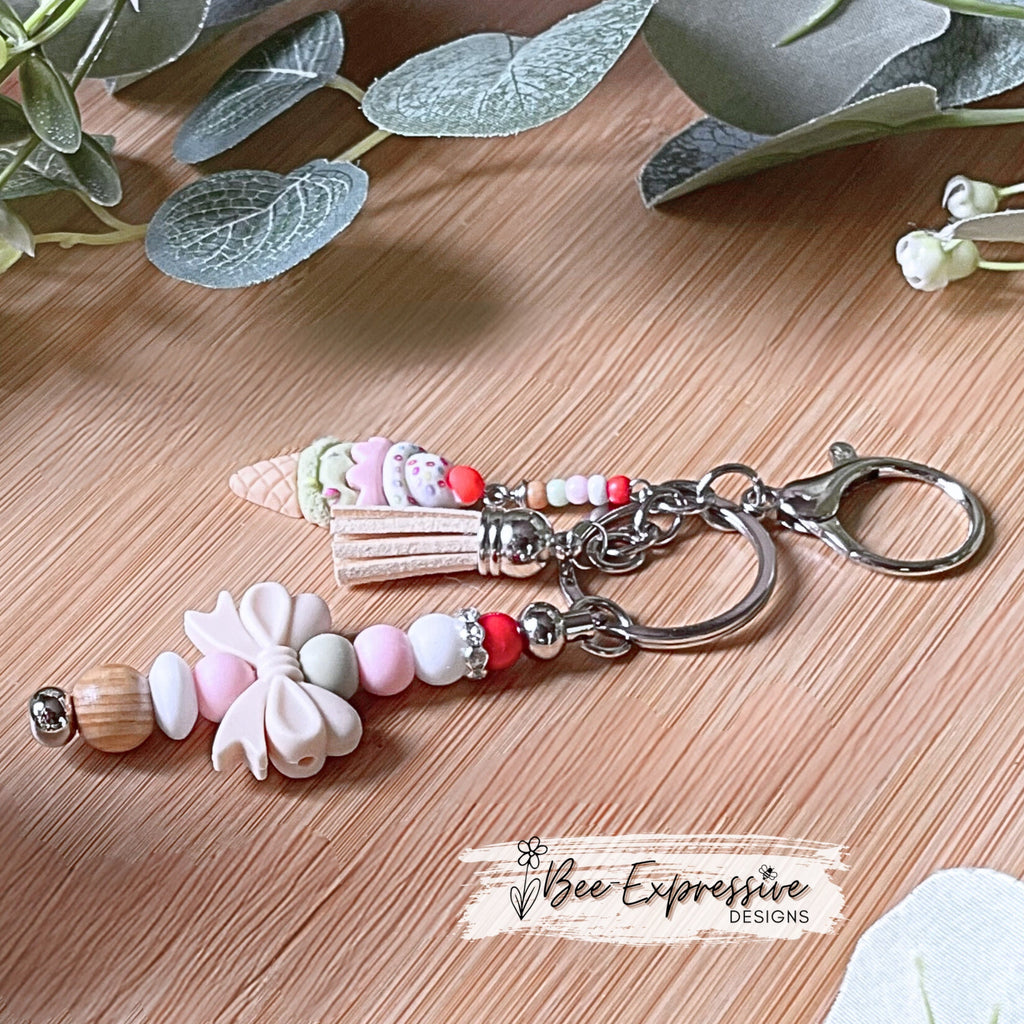 Adorable, handmade, beaded ice cream keychain! Choose a lobster claw or swivel clasp, metal bar, silicone bow, beaded tassel, dessert charm