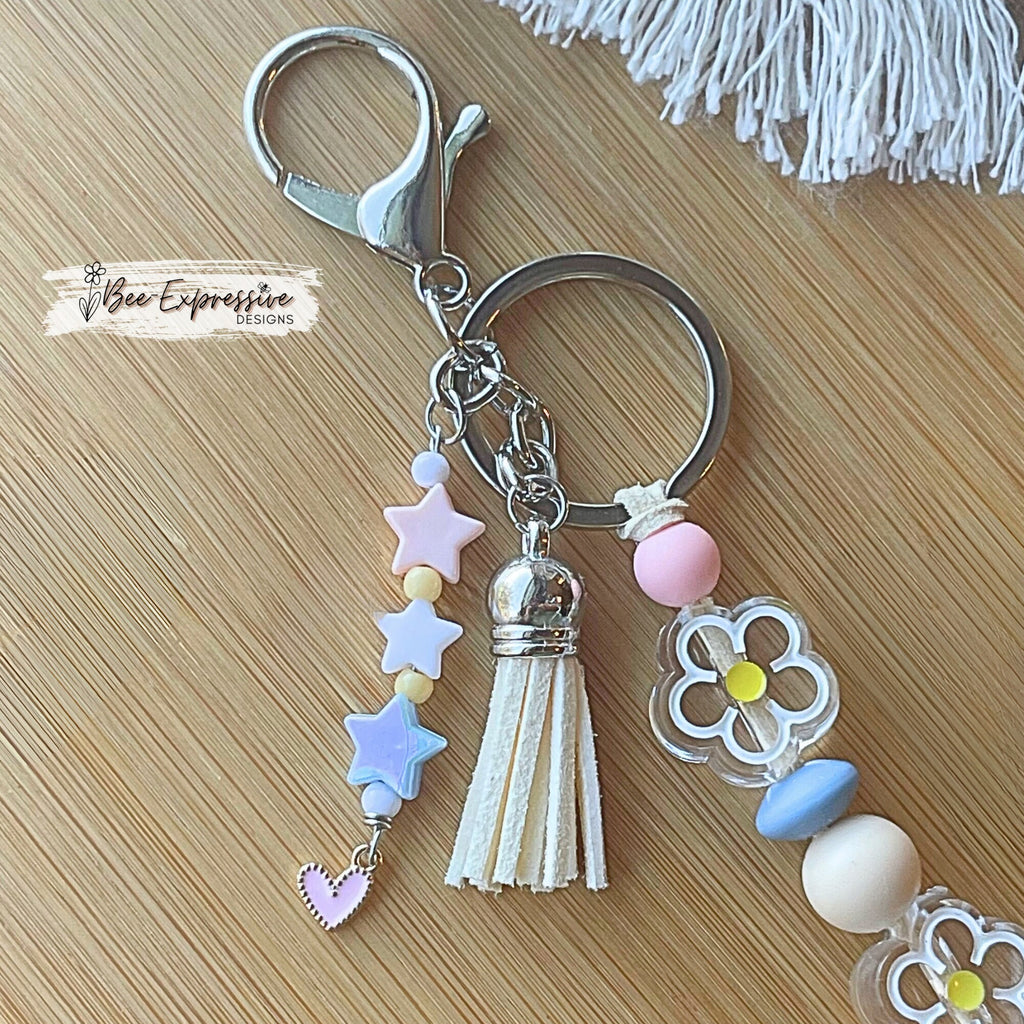 Beaded, rainbow and daisy flower, keychain! Lobster clasp, suede cord, silicone beads, acrylic flowers, beaded star tassel, pink heart charm