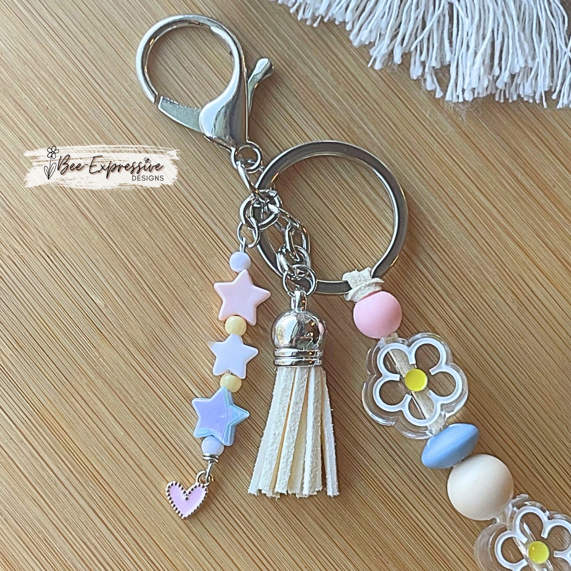 Beaded, rainbow and daisy flower, keychain! Lobster clasp, suede cord, silicone beads, acrylic flowers, beaded star tassel, pink heart charm