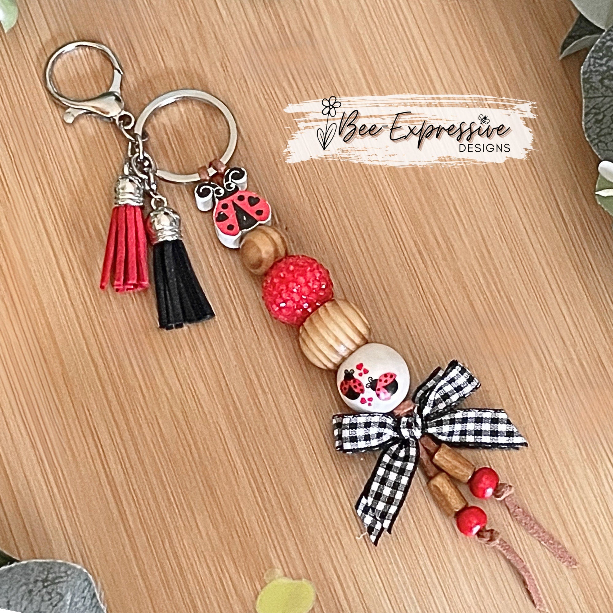 Handmade and unique, chunky bead, lady bug keychain!  Lobster claw clasp, suede cord, 20mm wood and acrylic beads, gingham bow, tassels