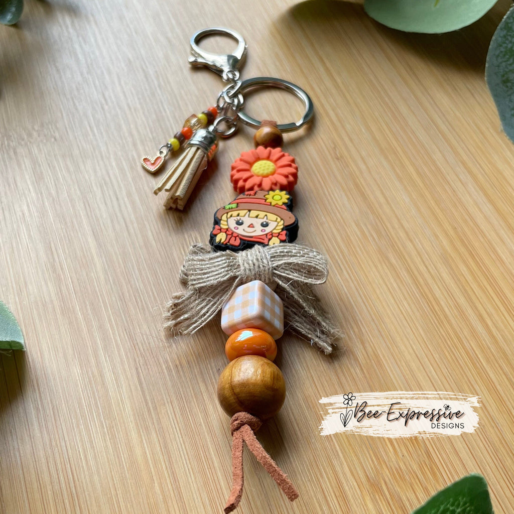 Adorable, handmade, scarecrow keychain or bag chain!  Lobster clasp, suede cord, checkered square, sunflower, beaded tassel, heart charm!