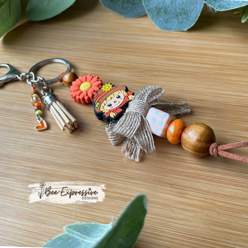Adorable, handmade, scarecrow keychain or bag chain!  Lobster clasp, suede cord, checkered square, sunflower, beaded tassel, heart charm!