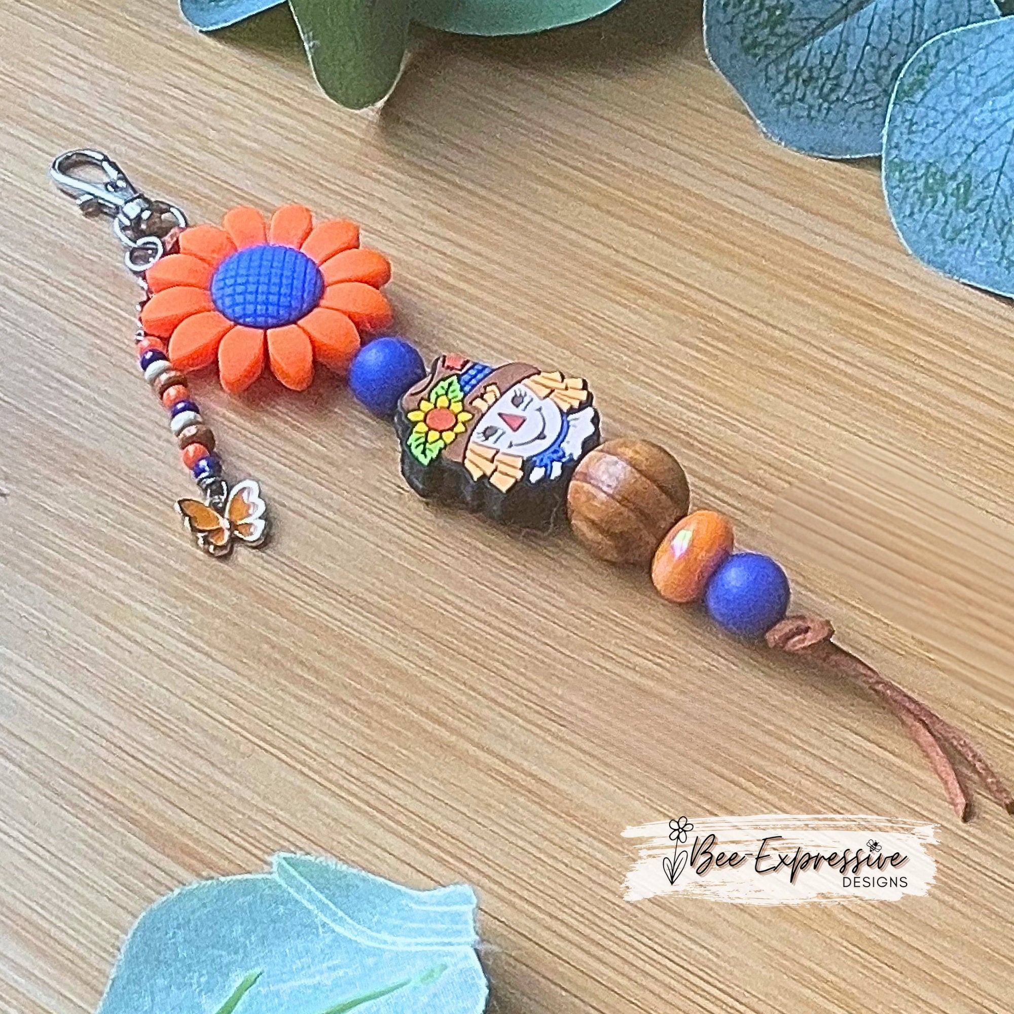 Adorable handmade, scarecrow keychain or bag chain!  Swivel or lobster clasp, cord, acrylic, silicone flower, beaded tassel, butterfly charm