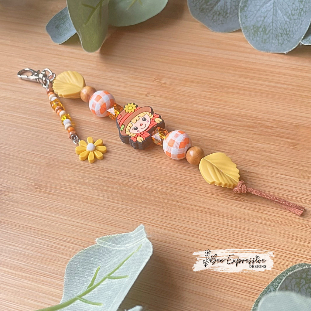 Handmade, beaded SCARECROW keychain! Swivel or lobster clasp, suede cord, silicone leaves, wood gingham, beaded tassel & flower charm!