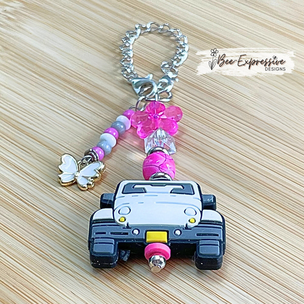 Handmade, white 4x4 vehicle charm chain for a tumbler!  Acrylic beads, lobster claw clasps, flower, beaded tassel, white butterfly charm!