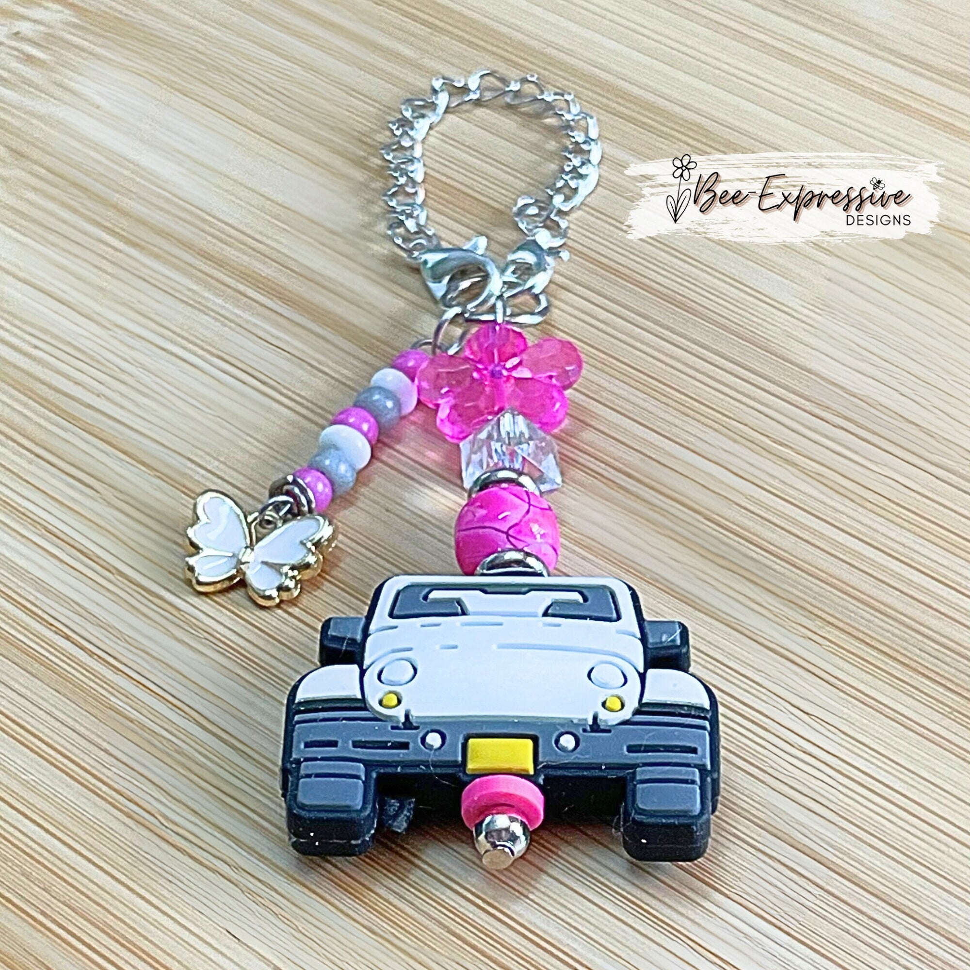 Handmade, white 4x4 vehicle charm chain for a tumbler!  Acrylic beads, lobster claw clasps, flower, beaded tassel, white butterfly charm!
