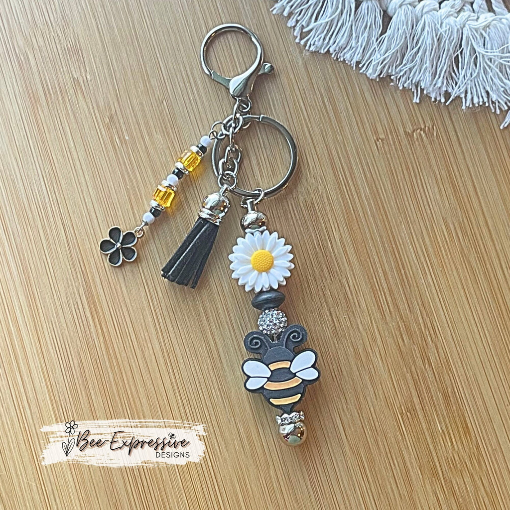 Handmade, bright and colorful, silicone daisy flower &  bumble bee keychain! Lobster clasp, beaded tassel, black flower charm, suede tassel
