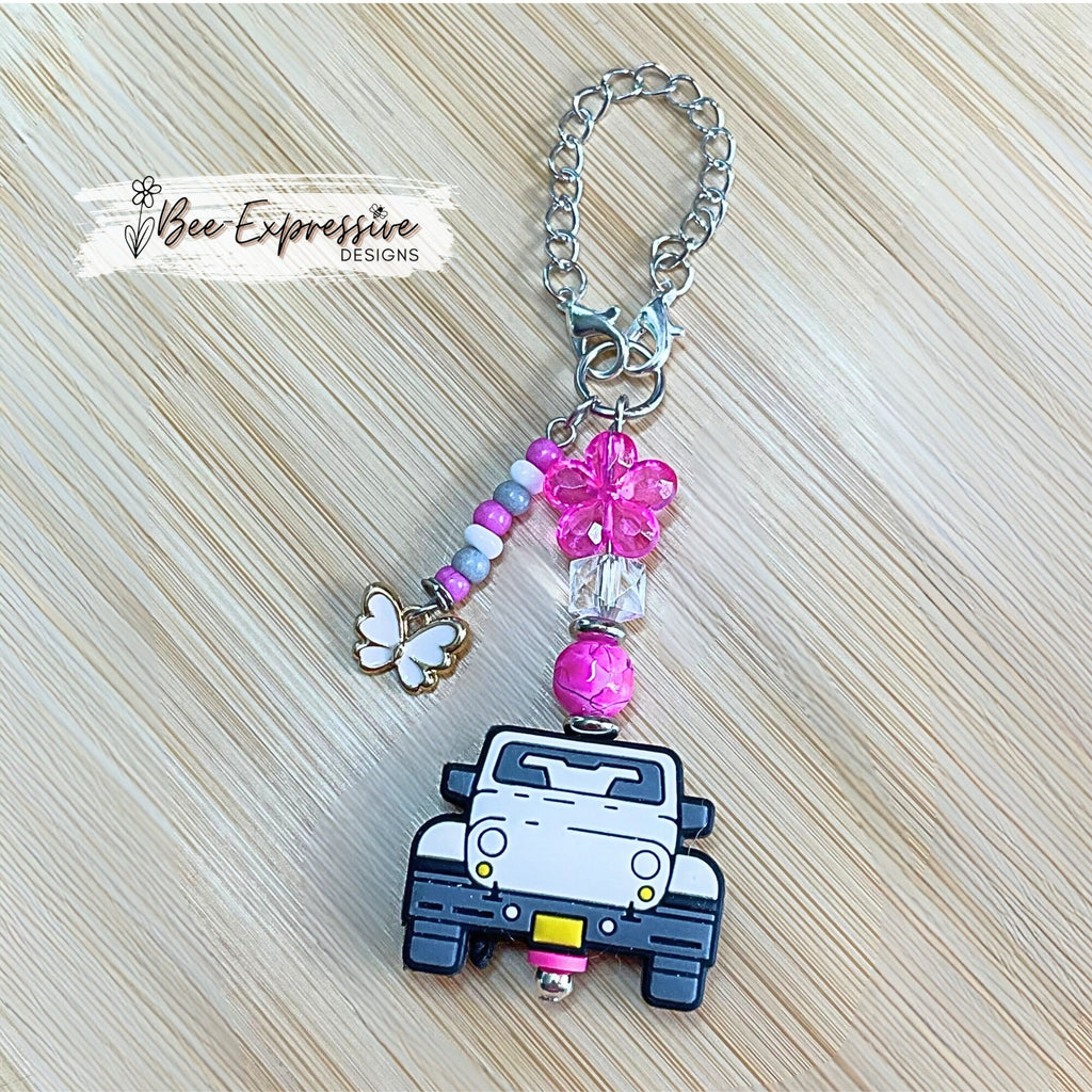 Handmade, white 4x4 vehicle charm chain for a tumbler!  Acrylic beads, lobster claw clasps, flower, beaded tassel, white butterfly charm!