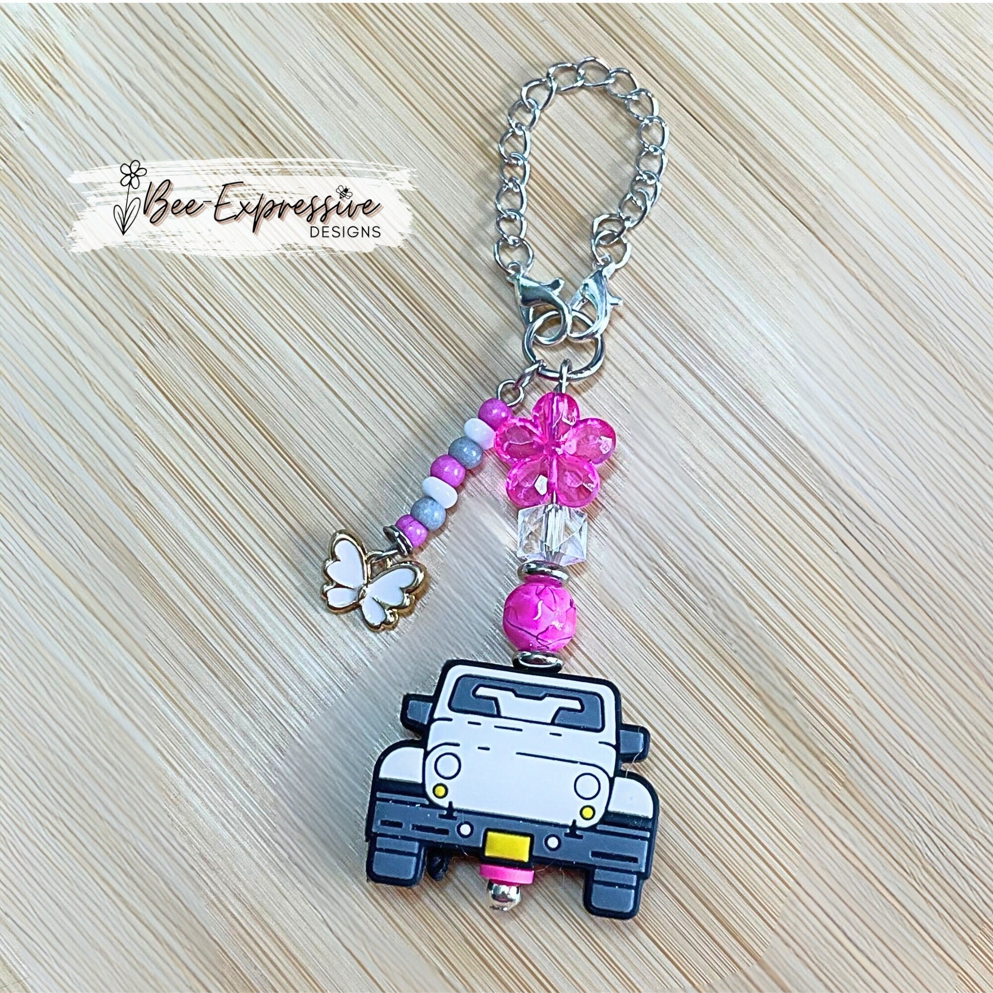 Handmade, white 4x4 vehicle charm chain for a tumbler!  Acrylic beads, lobster claw clasps, flower, beaded tassel, white butterfly charm!