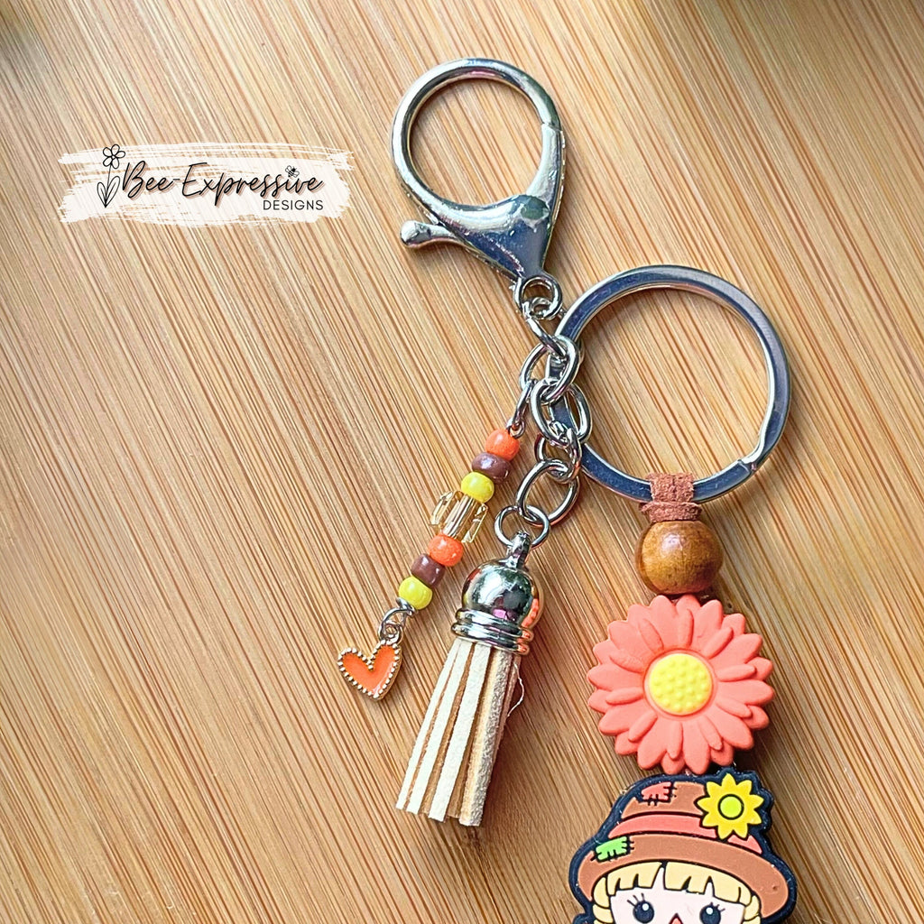 Adorable, handmade, scarecrow keychain or bag chain!  Lobster clasp, suede cord, checkered square, sunflower, beaded tassel, heart charm!