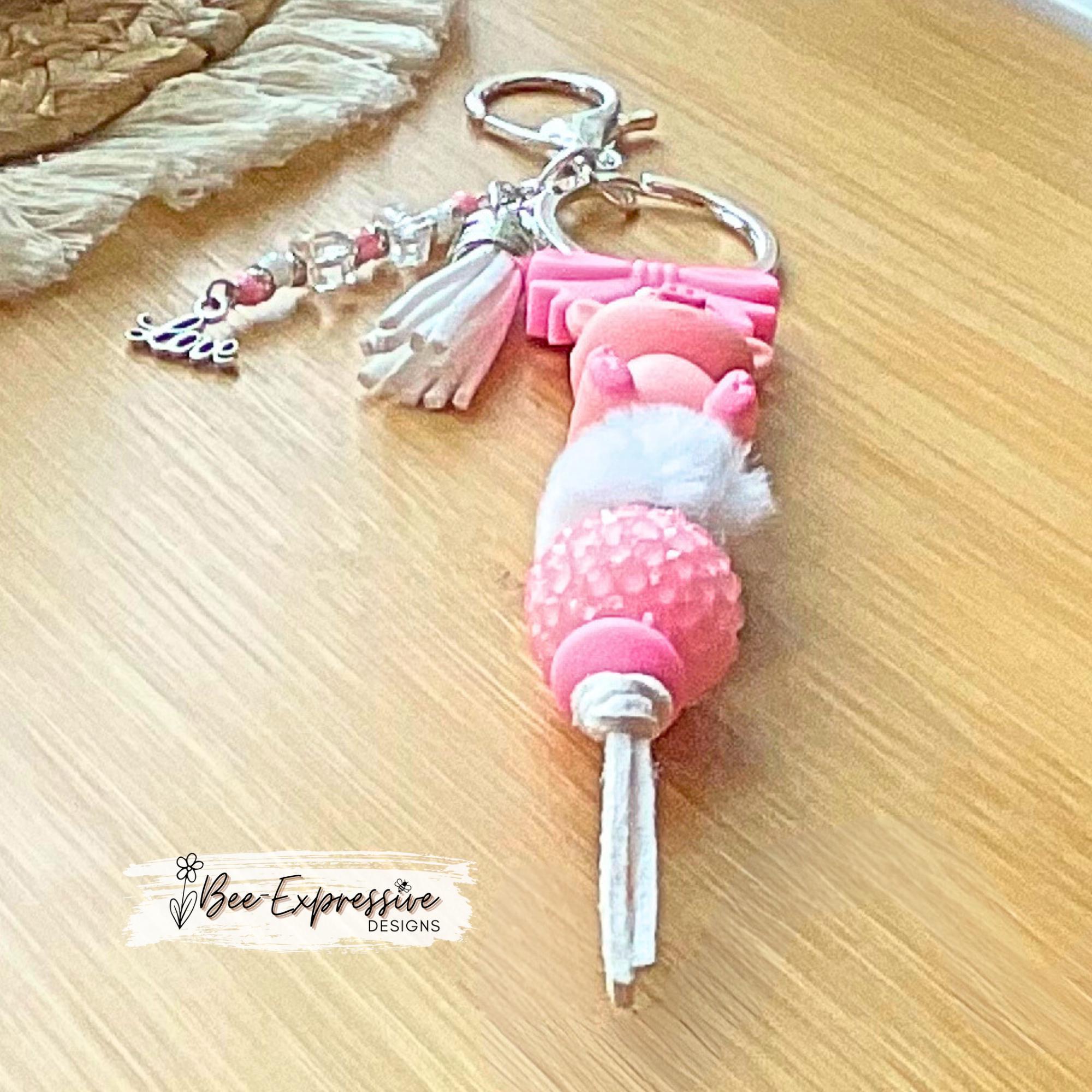 Beaded, 3D PIG keychain with a silicone pink bow! Lobster or swivel clasp, chunky rhinestone bead, fuzzy bead, beaded tassel & LOVE charm