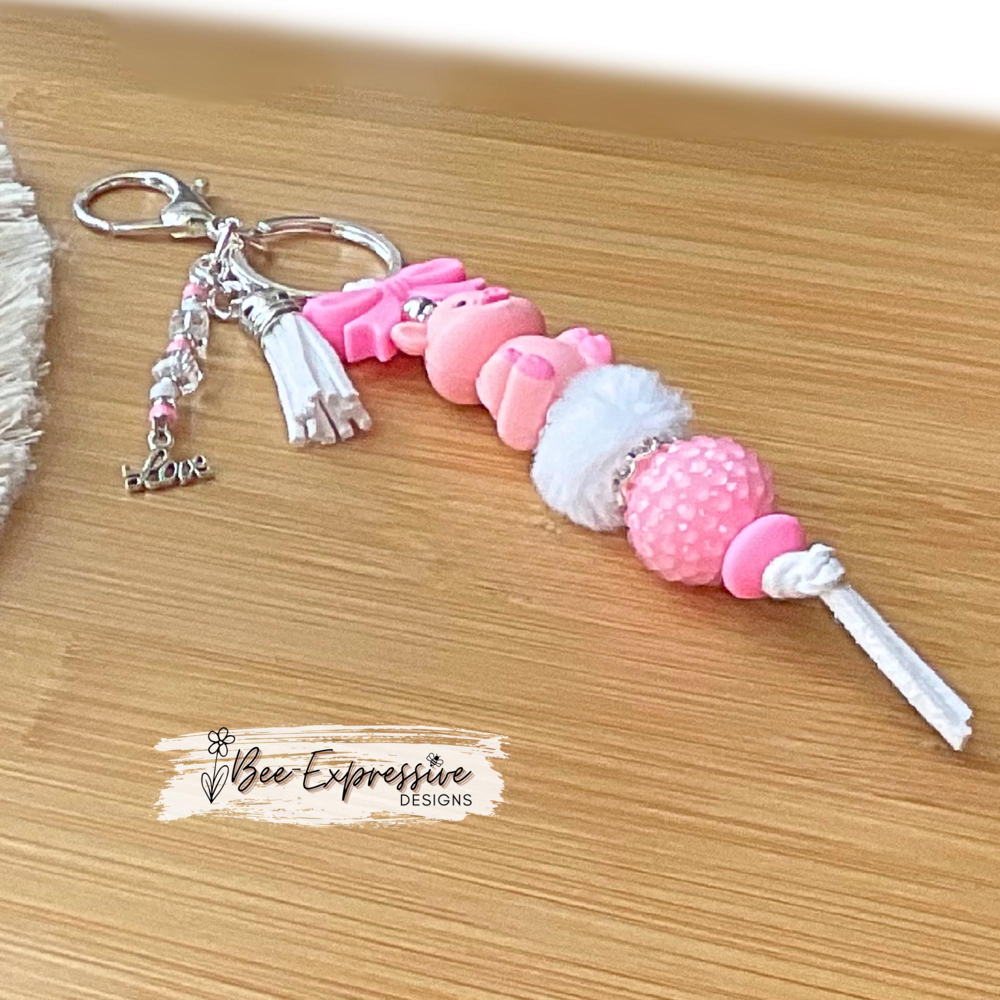 Beaded, 3D PIG keychain with a silicone pink bow! Lobster or swivel clasp, chunky rhinestone bead, fuzzy bead, beaded tassel & LOVE charm