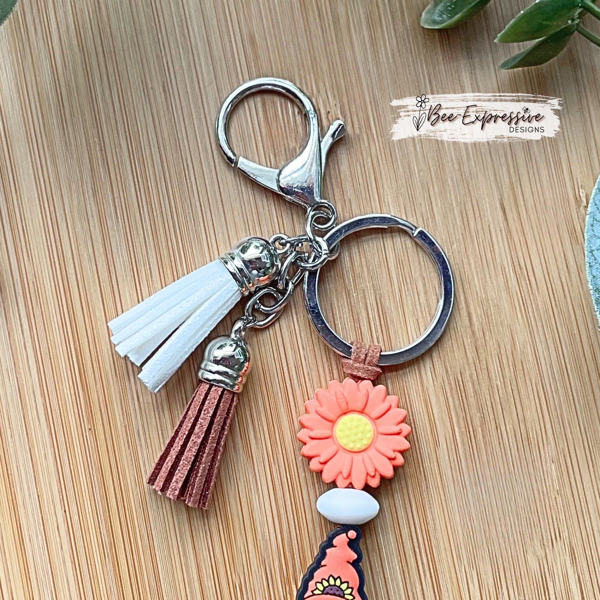 Handmade, unique, silicone sunflower gnome keychain!  Lobster clasp, suede cord, lentil beads, wood beads, girl gnome with orange braids