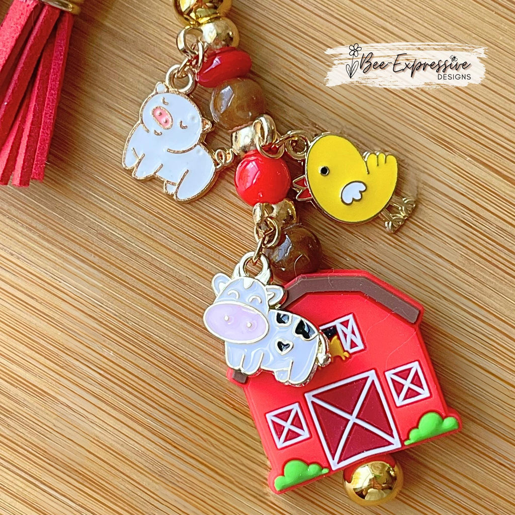 Farm animals & red barn keychain! Gold tone lobster or swivel clasp, metal bar, acrylic beads! Has a duck, cow, and a pig charm!