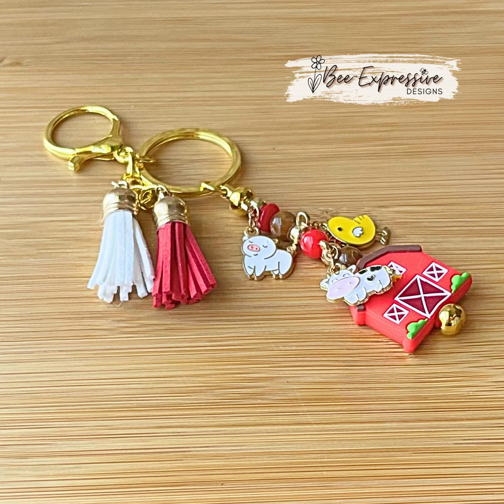 Farm animals & red barn keychain! Gold tone lobster or swivel clasp, metal bar, acrylic beads! Has a duck, cow, and a pig charm!