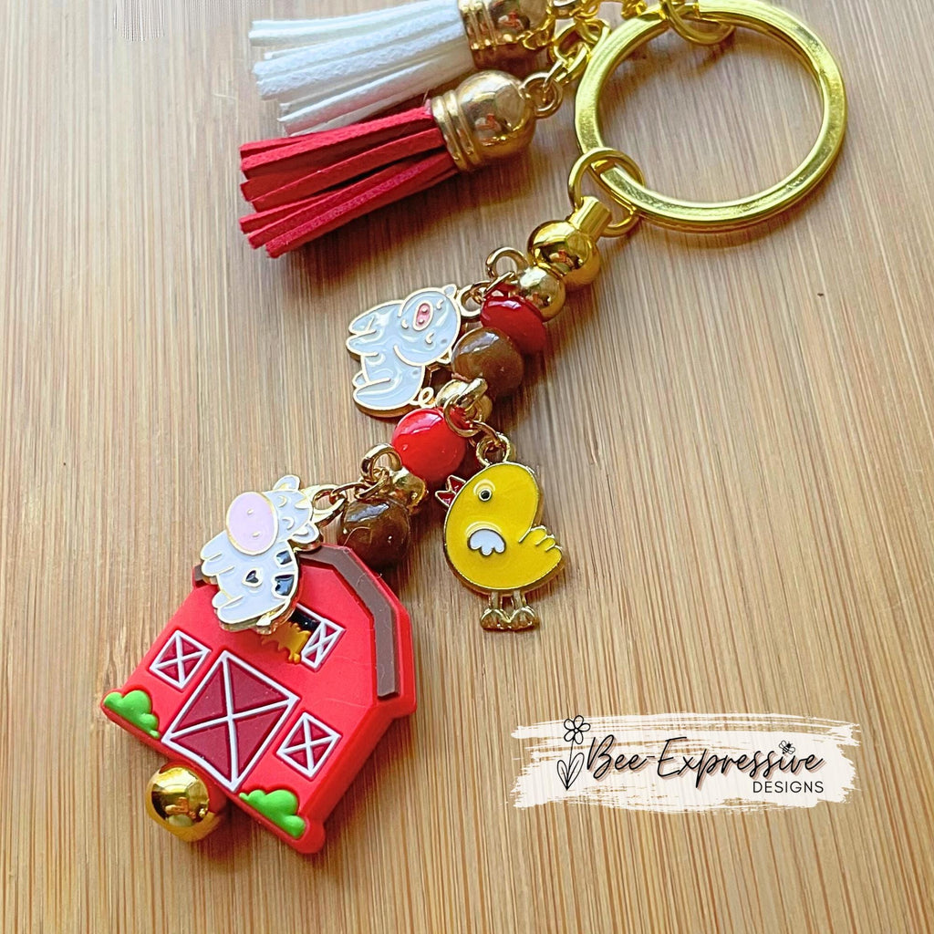 Farm animals & red barn keychain! Gold tone lobster or swivel clasp, metal bar, acrylic beads! Has a duck, cow, and a pig charm!