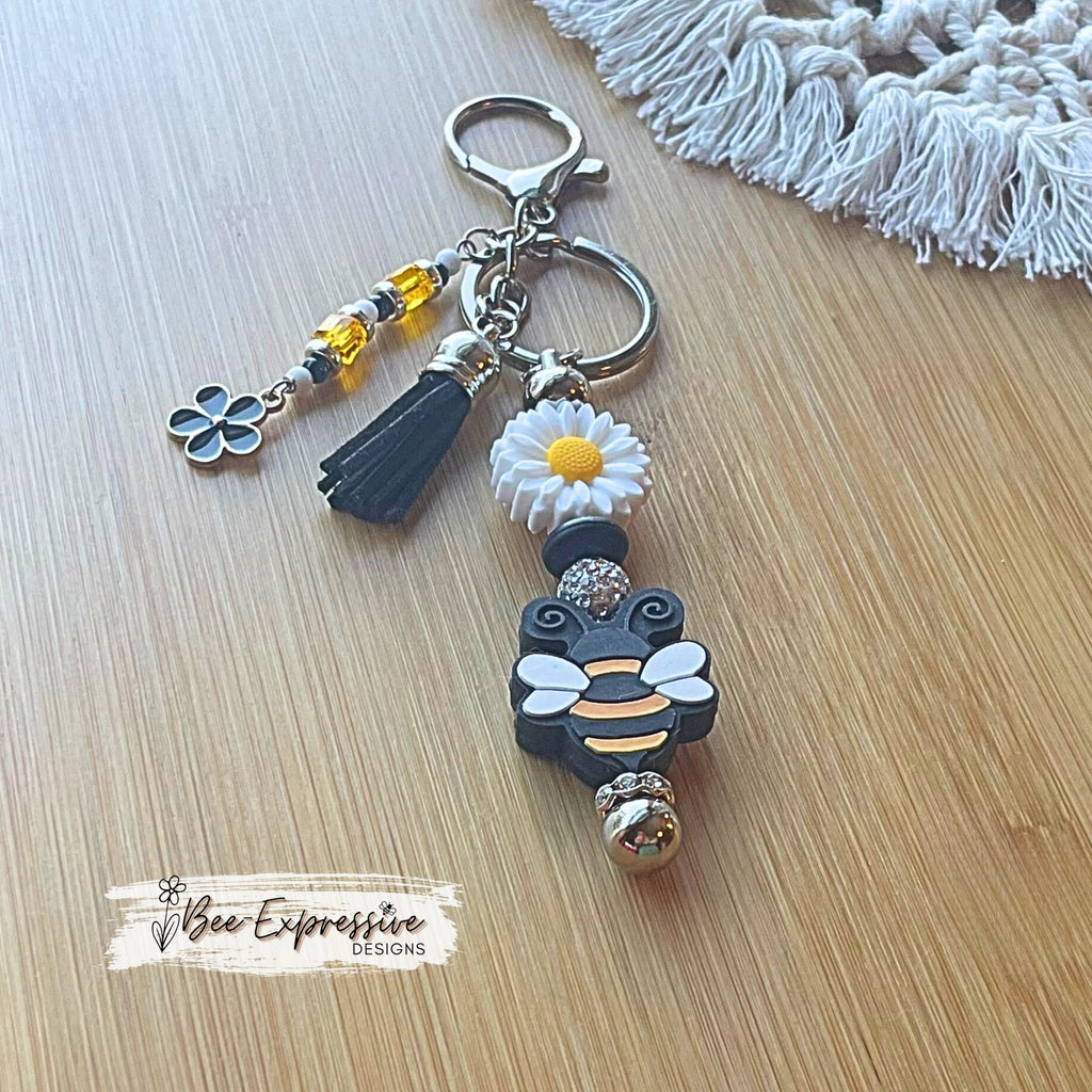 Handmade, bright and colorful, silicone daisy flower &  bumble bee keychain! Lobster clasp, beaded tassel, black flower charm, suede tassel