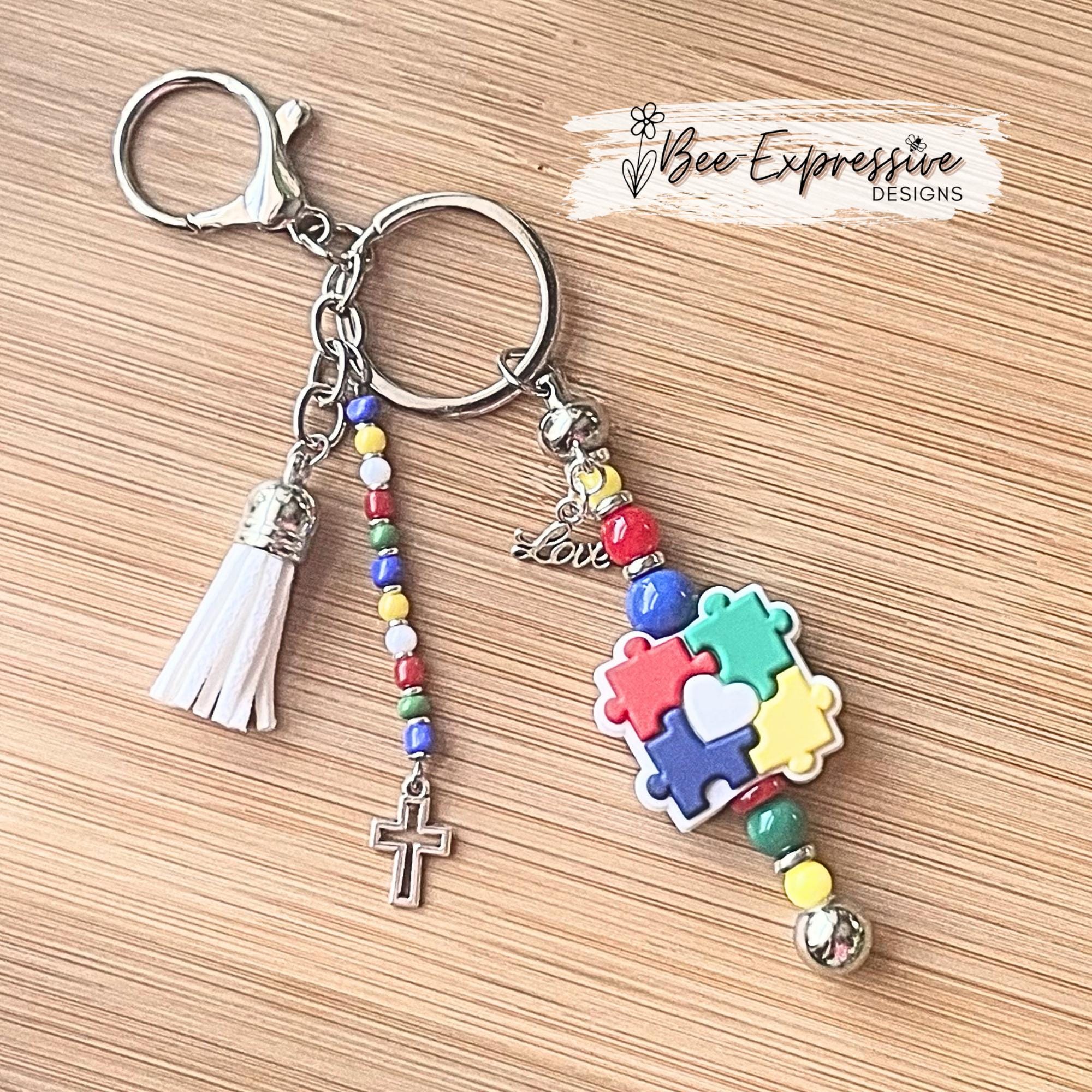 Autism Awareness Beaded Keychain: Puzzle Piece Charm, Acrylic Tassel with a Cross Charm