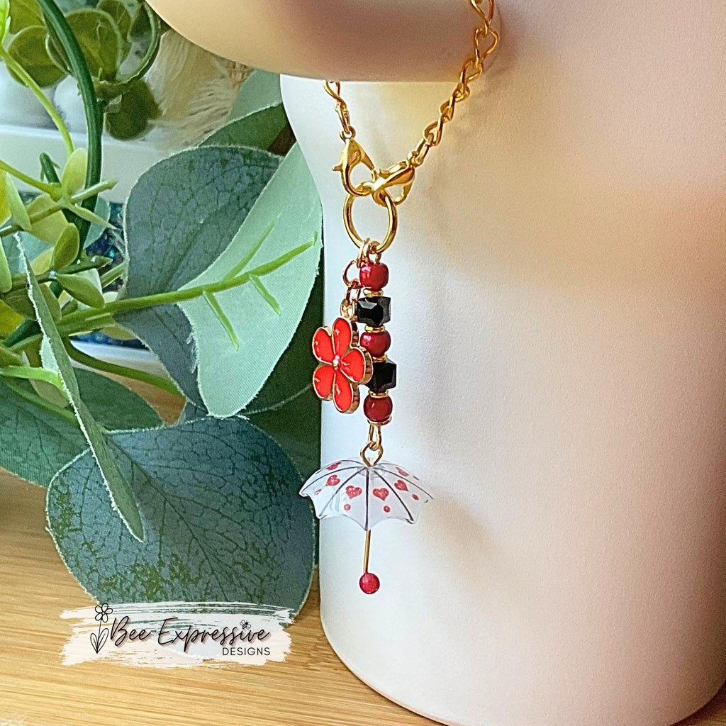 Beaded, umbrella charm chain for the Stanley tumbler! Acrylic beads, gold toned spacers, red daisy flower charm, lobster clasps, unique!