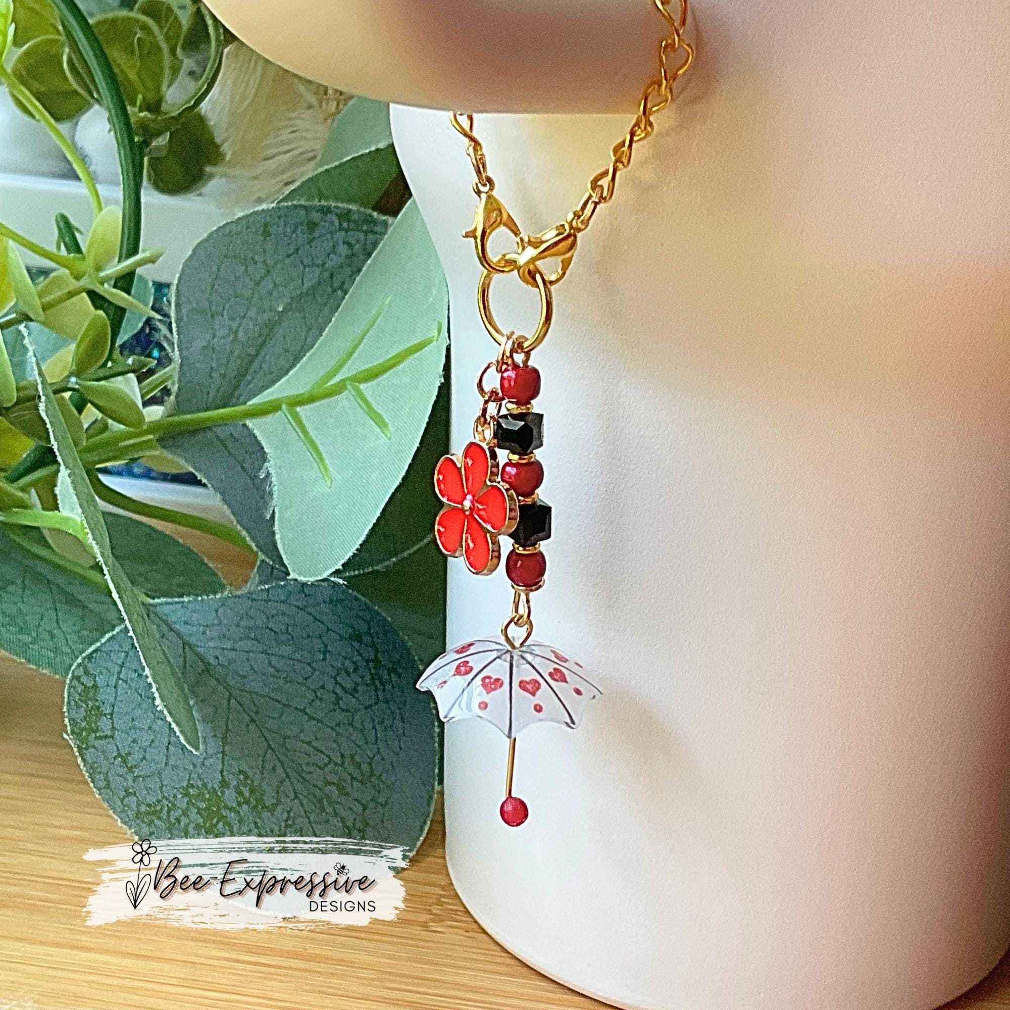 Beaded, umbrella charm chain for the Stanley tumbler! Acrylic beads, gold toned spacers, red daisy flower charm, lobster clasps, unique!