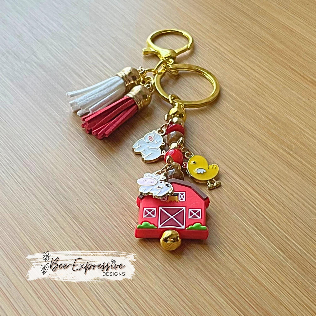Farm animals & red barn keychain! Gold tone lobster or swivel clasp, metal bar, acrylic beads! Has a duck, cow, and a pig charm!