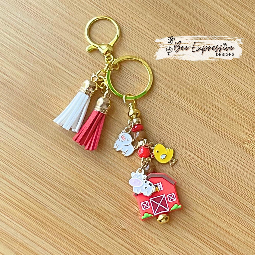 Farm animals & red barn keychain! Gold tone lobster or swivel clasp, metal bar, acrylic beads! Has a duck, cow, and a pig charm!