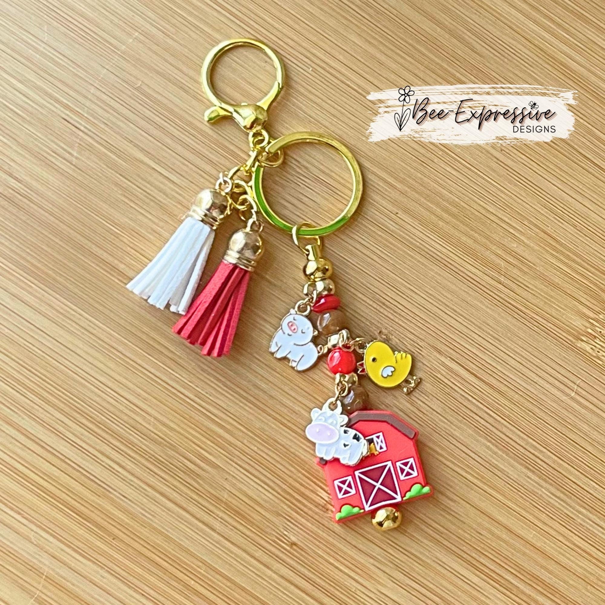 Farm animals & red barn keychain! Gold tone lobster or swivel clasp, metal bar, acrylic beads! Has a duck, cow, and a pig charm!