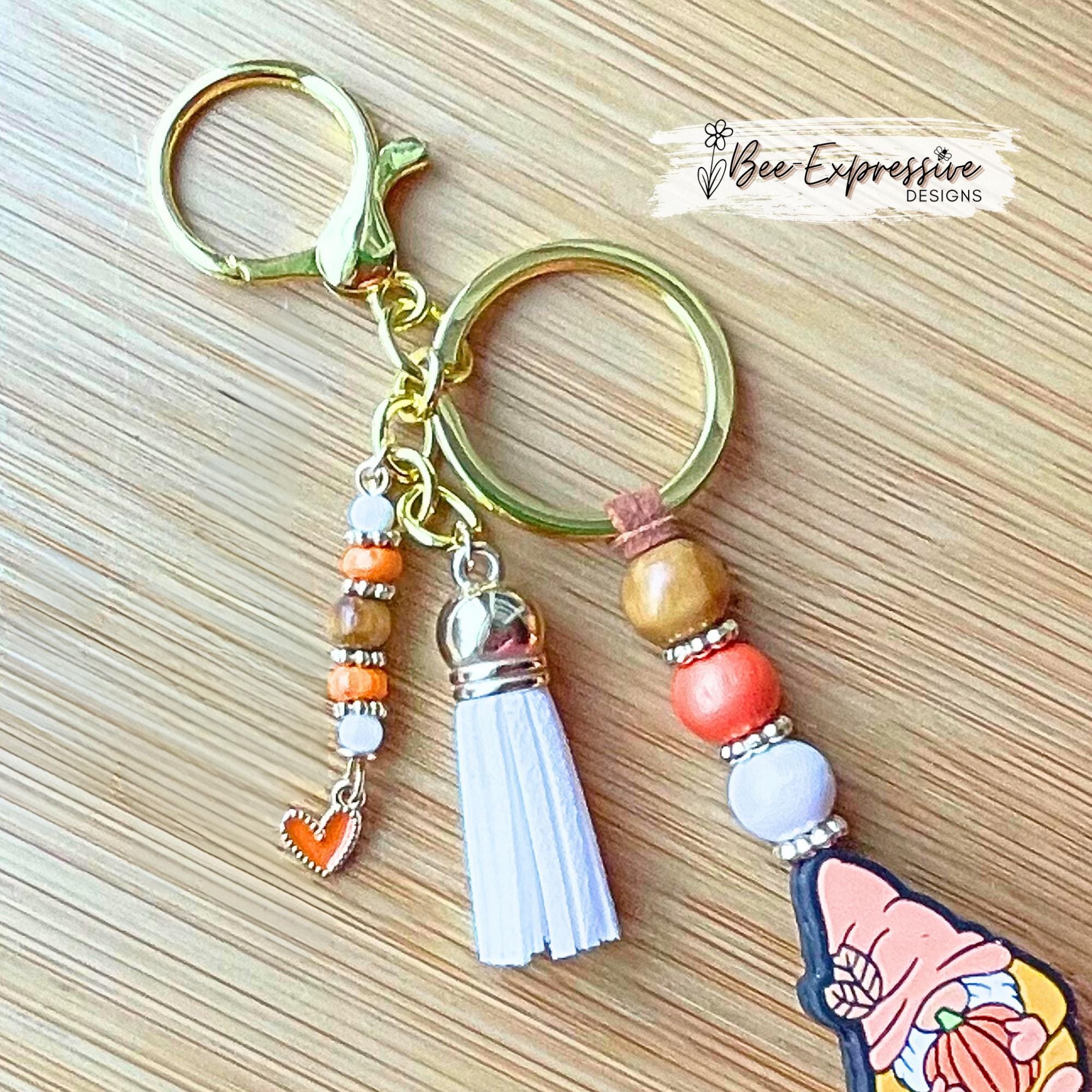 Fall GNOME keychain! Lobster or swivel clasp, suede cord, studded spacers, wood & silicone beads, pumpkin, beaded tassel with heart charm!