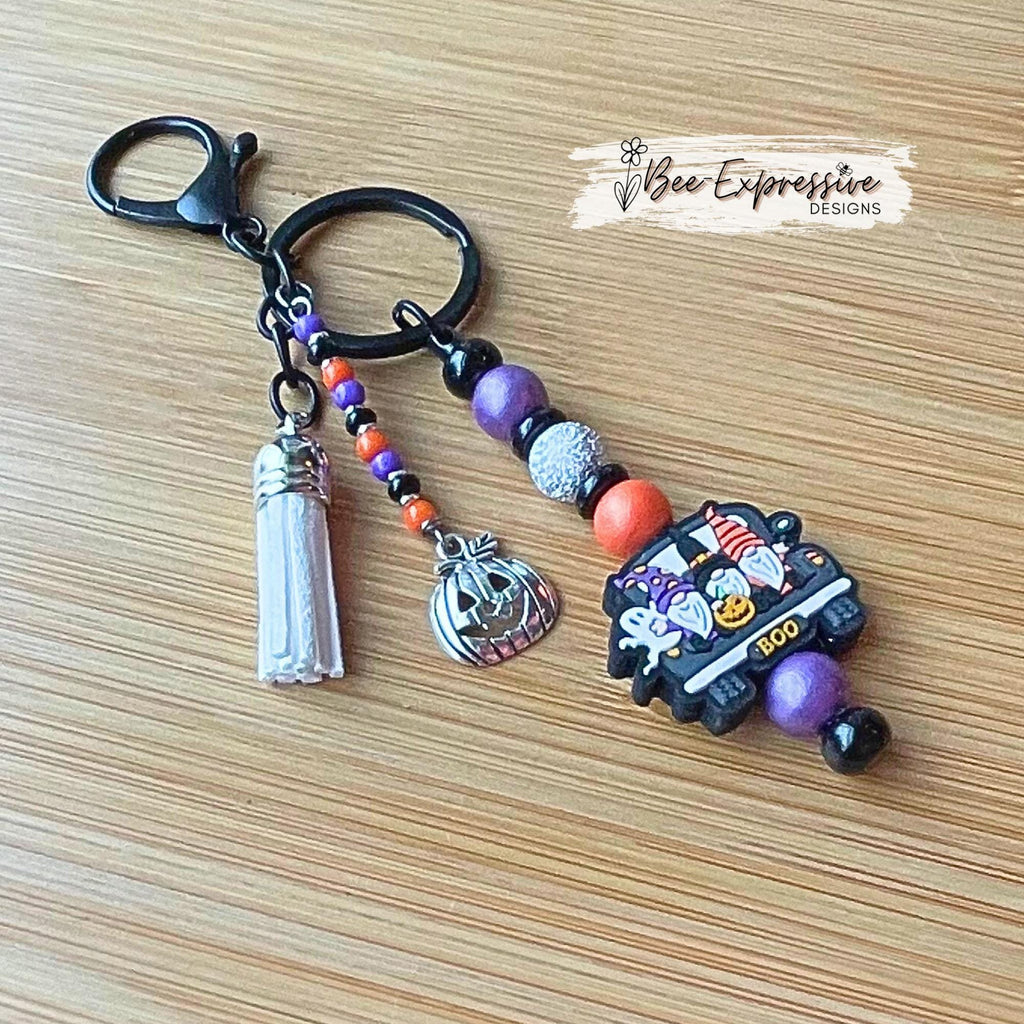 Handmade, unique, silicone HALLOWEEN gnome keychain! Lobster clasp, beaded bar, wood beads, acrylic spacers, beaded tassel, pumpkin charm