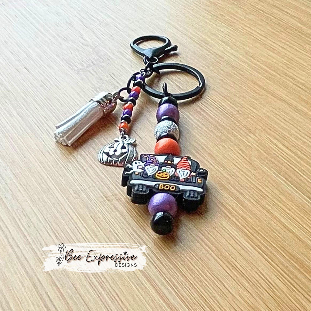 Handmade, unique, silicone HALLOWEEN gnome keychain! Lobster clasp, beaded bar, wood beads, acrylic spacers, beaded tassel, pumpkin charm