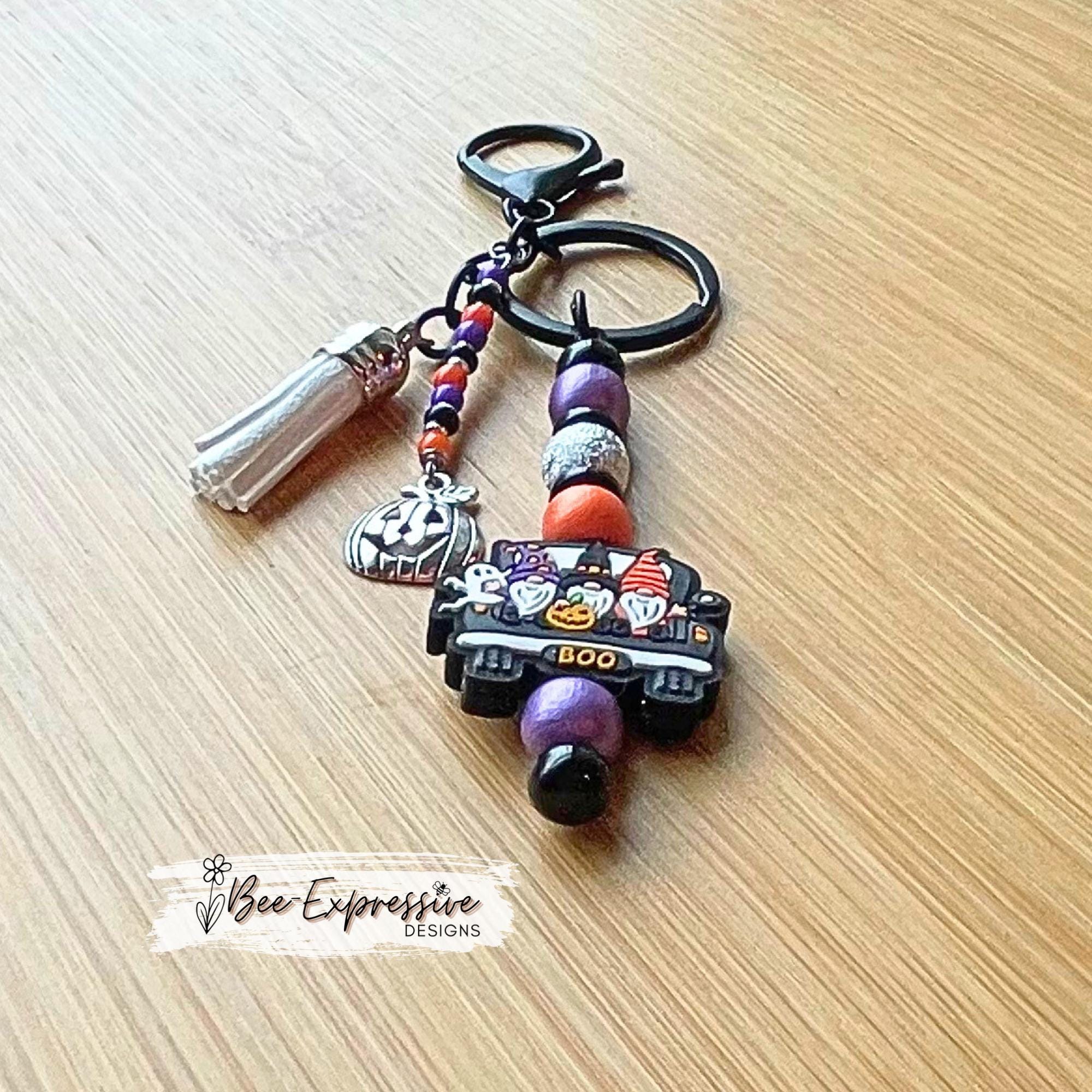 Handmade, unique, silicone HALLOWEEN gnome keychain! Lobster clasp, beaded bar, wood beads, acrylic spacers, beaded tassel, pumpkin charm