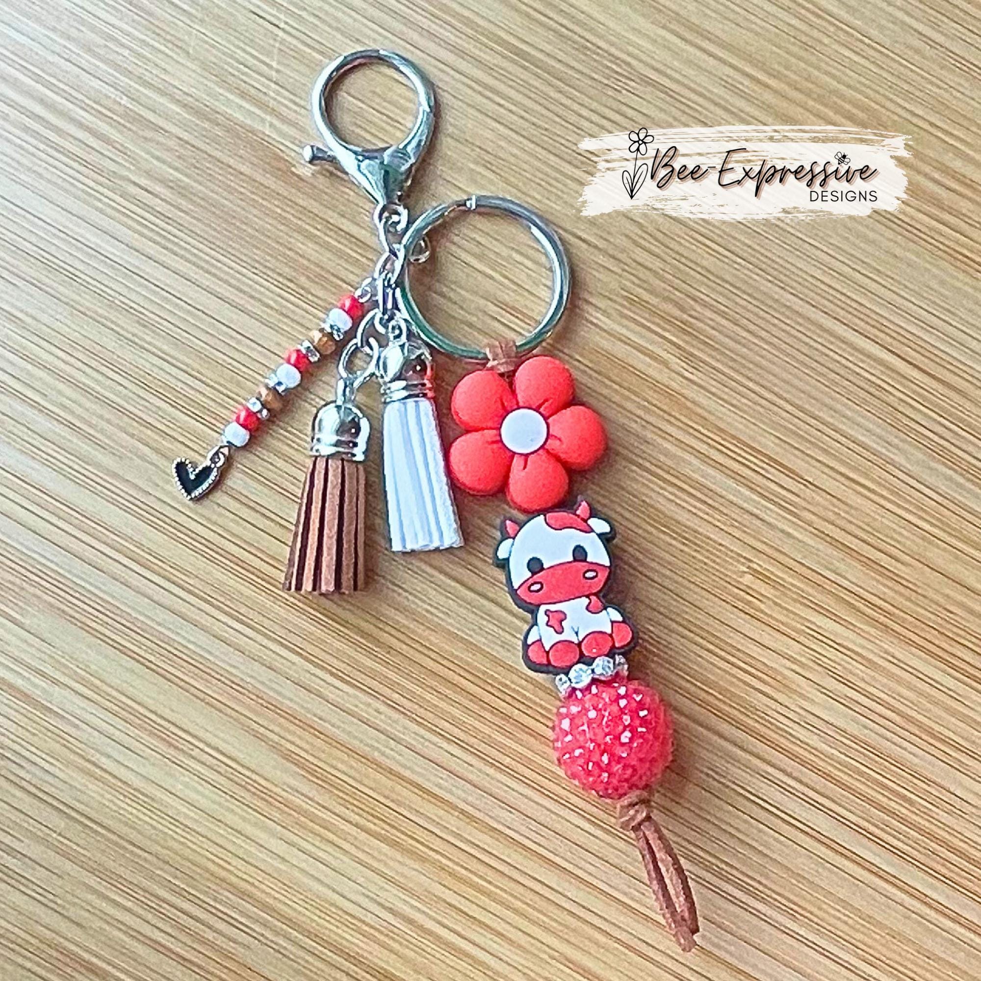 Handmade, RED COW keychain! Lobster or swivel clasp, suede cord chunky rhinestone bead, silicone daisy flower, beaded tassel w/ heart charm!