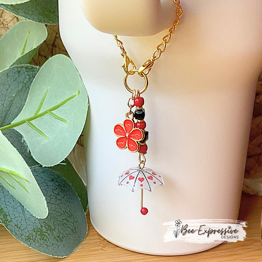 Beaded, umbrella charm chain for the Stanley tumbler! Acrylic beads, gold toned spacers, red daisy flower charm, lobster clasps, unique!