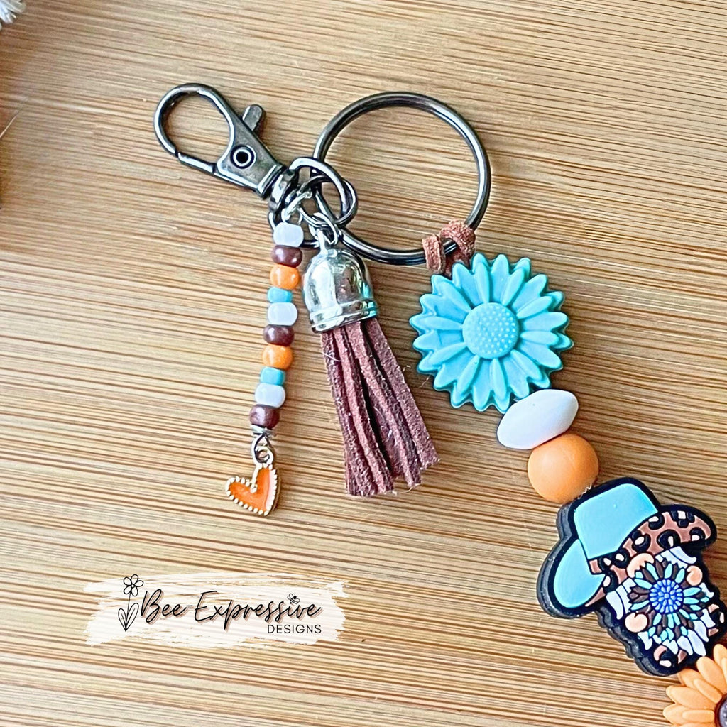 Handmade, unique, western GNOME keychain! Swivel clasp, suede cord, lentil beads, chunky bead, focal bead, beaded tassel with heart charm!
